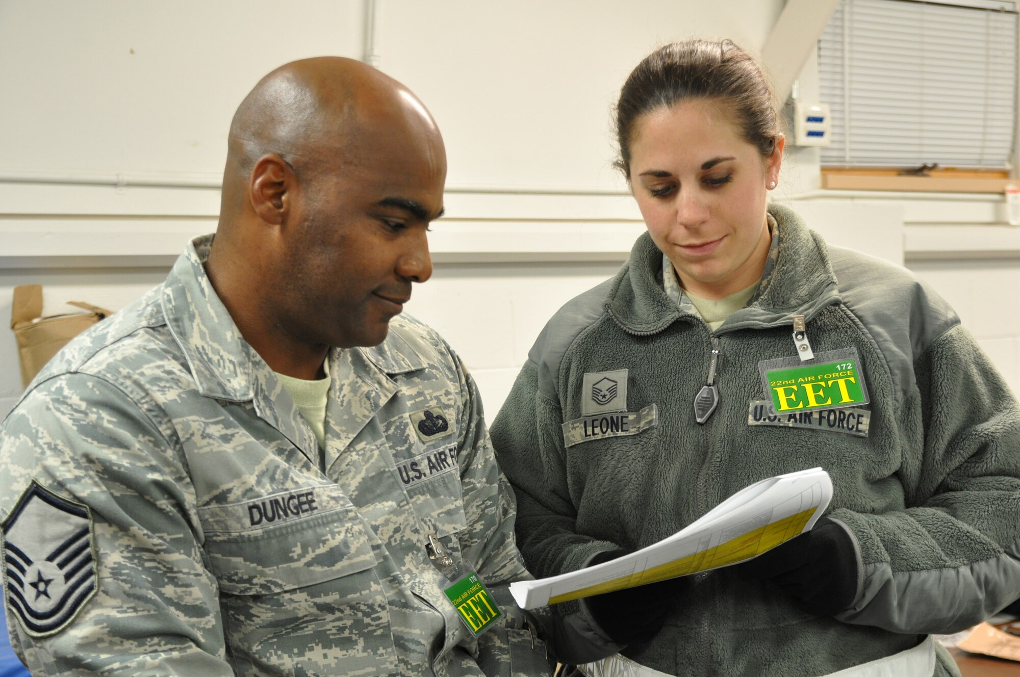 US Air Force Reserve Master Sgt. Amber Leone, a member of the 910th Force Support Squadron, reviews a drill scenario with Master Sgt. Jo'Vor Dungee, a member of the 22nd Air Force, Dobbins Air Reserve Base, Ga.

Leone and approximately 29 other 910th Airlift Wing Airmen participated as an Exercise Evaluation Team March 29–April 4, at Alpena Combat Readiness Training Center, Mich. The team evaluated Air Force Reservists and Air National Guardsmen from Niagara Falls Air Reserve Station, N.Y. who demonstrated their war skills during an Operational Readiness Exercise. U.S. Air Force photo by Maj. Colleen VanNatta
