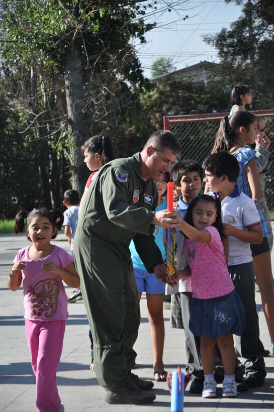 SANTIAGO, Chile – Col. Stephen Pedrotty, 12th Air Force (Air Forces Southern) Air Boss/A3 director, visited children to teach them about space partnerships at the SOS Aldeas orphanage in Santiago, Chile, March 29. The Chilean air force invited U.S. Airmen to help them give back to the community by visiting local hospitals and orphanages this week.  (U.S. Air Force photo/Master Sgt. Kelly Ogden)