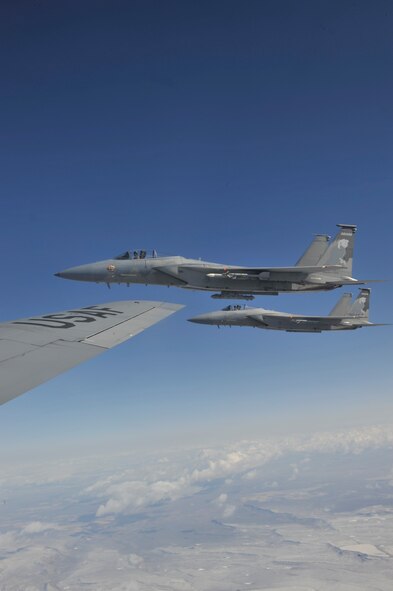 Two F-15 Eagles from Kingsley Field Air National Guard Base, Ore., fly with a KC-135 Stratotanker, assigned to Fairchild Air Force Base, Wash., above southern Oregon during a refueling training mission, March 28, 2012. The training mission was an opportunity for community members to experience Fairchild’s mission first hand. (U.S. Air Force Photo by Airman 1st Class Mary O’Dell/Released)