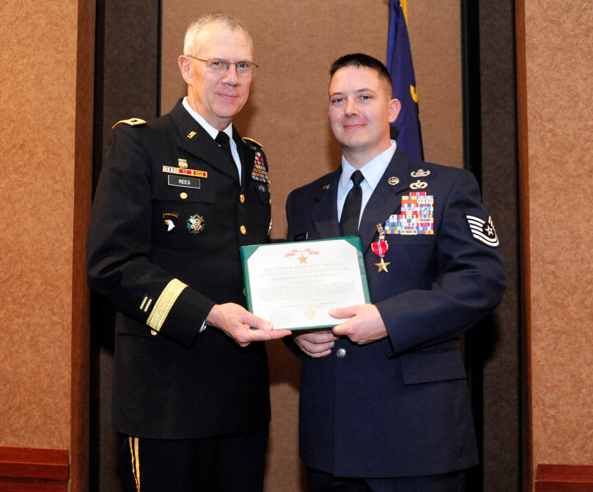 Maj. Gen. Raymond Rees, Adjutant General for the State of Oregon, presents the Bronze Star Medal and certificate to Tech. Sgt. Mendell "Trey" Holley, Feb. 27, 2010, at the Oregon Air National Guard Awards Banquet, Portland, Ore. (stock photo by Tech. Sgt. Greg Neuleib (ret.) 142nd Fighter Wing Public Affairs Department) 


