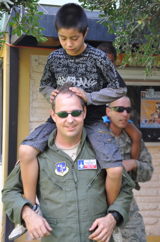 SANTIAGO, Chile – Capt. Sandie Murphy, a C-130 Hercules pilot with the 136th Airlift Wing, visited children at the SOS Aldeas orphanage in Santiago, Chile, March 29. The Chilean air force invited U.S. Airmen to help them give back to the community by visiting local hospitals and orphanages this week.  (U.S. Air Force photo/Master Sgt. Kelly Ogden)