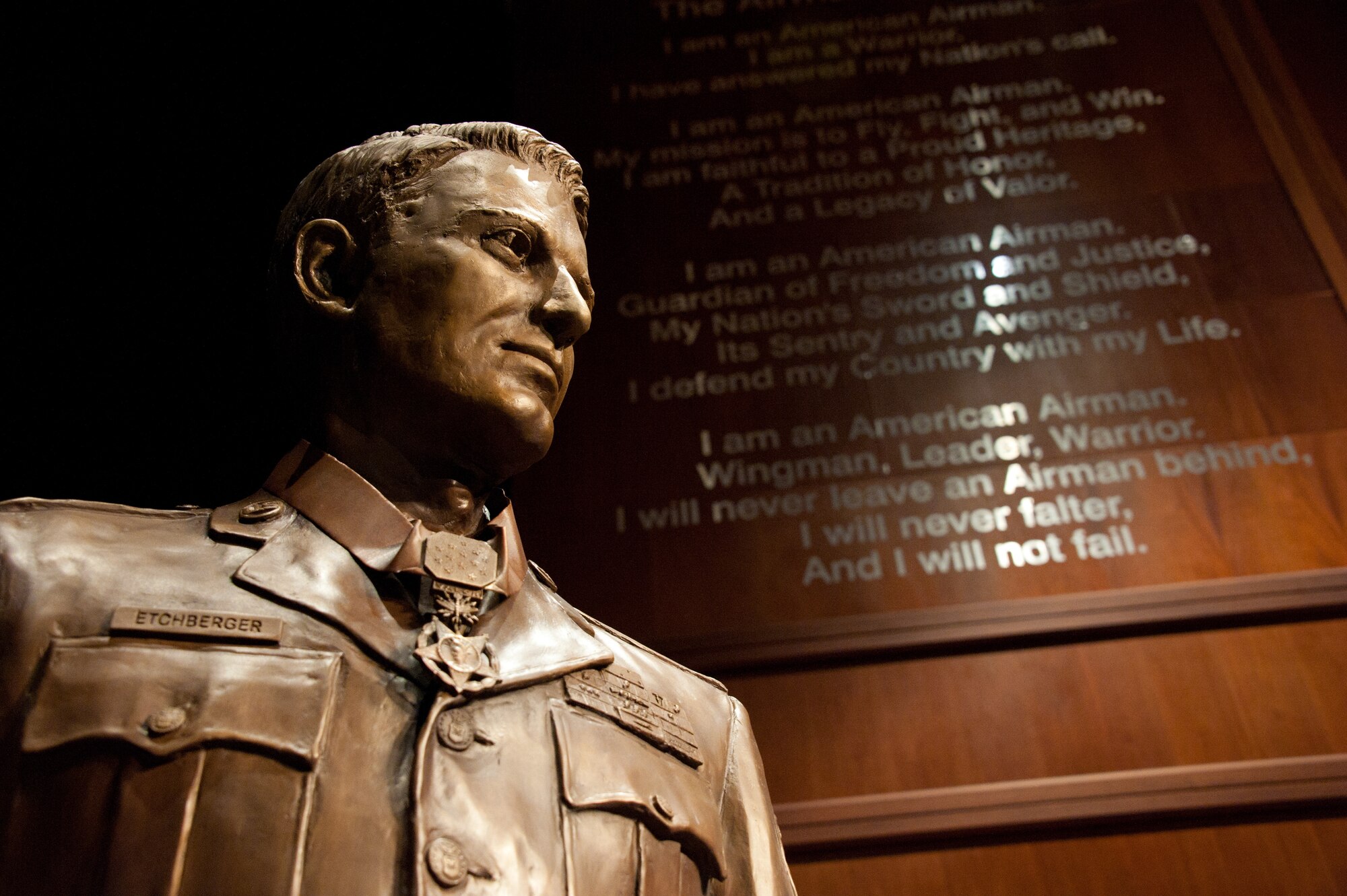 The bust of Medal of Honor recipient Chief Master Sgt. Richard L. Etchberger shines onstage at the Air Force Senior NCO Academy at Gunter Annex, Ala., March 26, 2012. The bust, sculpted by John Lajba, will be a part of the permanent exhibit at the academy. (U.S. Air Force photo/Melanie Rodgers Cox)