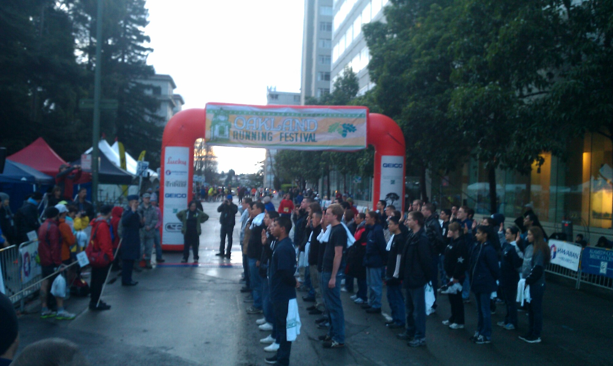 Lt. Col. Eric Espino, 364th Recruiting Squadron commander, administers the oath of enlistment to the 44 newest members of the Delayed Enlistment Program during the pre-start ceremony at the 2012 Oakland Running Festival.  Nineteen squadron members served as race volunteers and 16 squadron members ran the half-marathon, raising over $10K for local charities. (U.S. Air Force photo/Tech. Sgt. Leo Morales)
