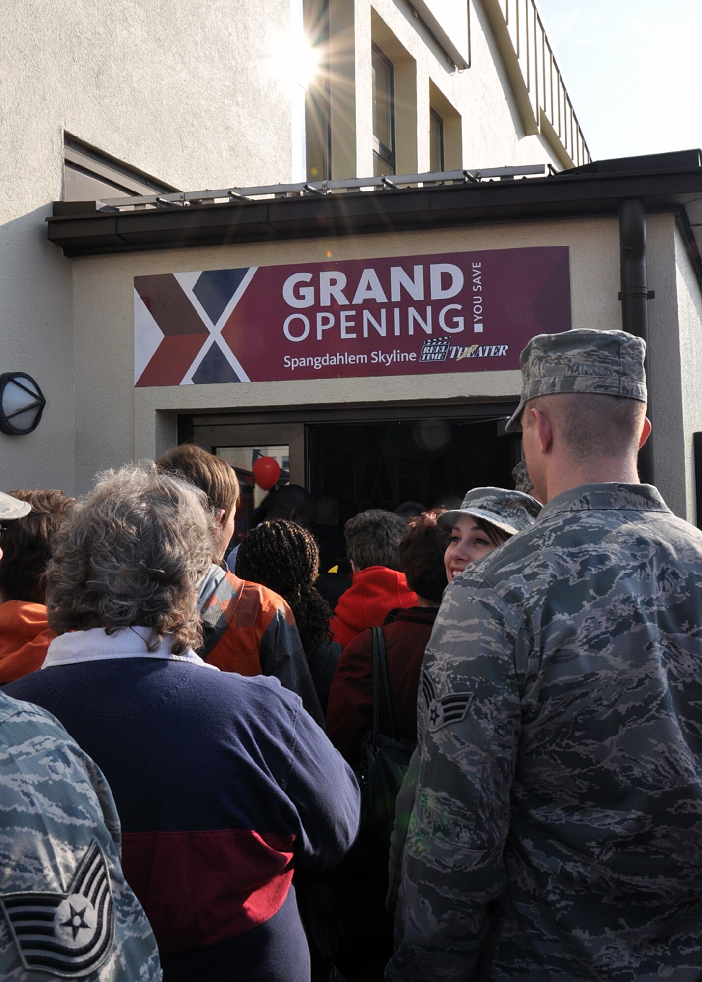 SPANGDAHLEM AIR BASE, Germany – Moviegoers enter the Spangdahlem Skyline Theater here April 4 after a reopening ribbon-cutting ceremony. The theater had been closed for nearly three months for a $925,850 renovation and upgrade project to the facility and its systems. The money came from shared financial contributions between the Exchange and Spangdahlem’s Commander in Chief’s 2011 Installation Excellence award. This is the first Exchange theater in the world to have 3-D capabilities and full digital audio and video, and more than 400 people attended the first movie showing. (U.S. Air Force photo by Staff Sgt. Daryl Knee/Released)
