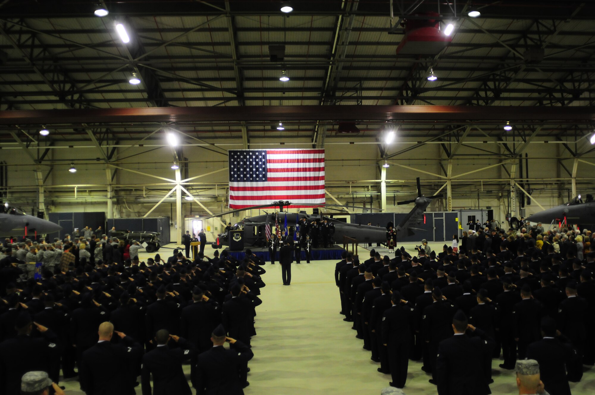ROYAL AIR FORCE LAKENHEATH, England – Airmen render salutes while the British and American national anthems are played during the 48th Fighter Wing change of command ceremony April 5, 2012. The outgoing commander, Col. John Quintas, relinquished command of the 48th FW to Col. Kyle Robinson. (U.S. Air Force photo by Airman 1st Class Cory D. Payne)