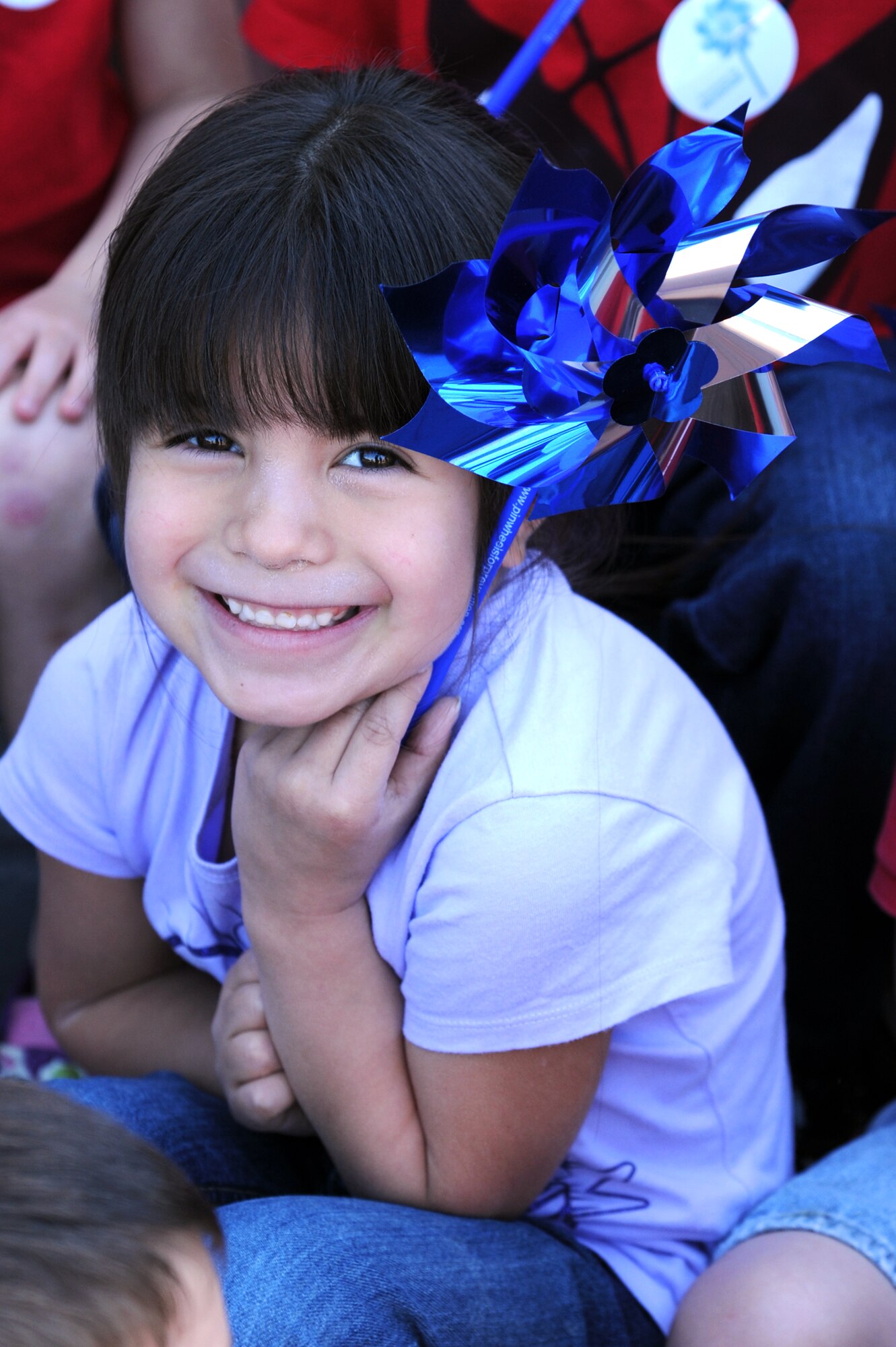 Hailey Moreno, 5, smiles for the camera with a pinwheel at the Child Abuse Prevention Month proclamation ceremony at City Hall in Goldsboro, N.C., April 3, 2012. Children were given pinwheels to represent the prevention of child abuse. In order to help change the way Americans think about prevention, event speakers encouraged attendees to focus on supporting community activities and public policies that ensure child safety. Moreno is the daughter of U.S Air Force Senior Airman Richard Moreno, 4th Civil Engineer Squadron electrician, from Wichita Falls, Texas. (U.S. Air Force photo/Senior Airman Whitney Stanfield/Released)