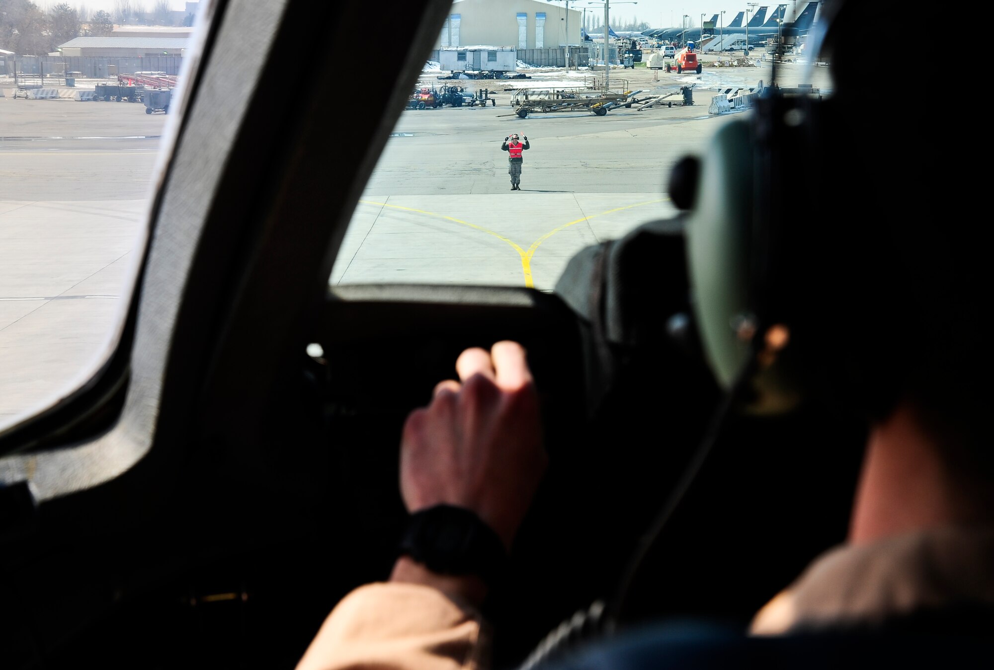 Capt. Bill Scharfenberg parks a C-17 Globemaster III March 20, 2012, at the Transit Center at Manas, Kyrgyzstan. Scharfenberg is an 817th Expeditionary Airlift Squadron Detachment 1 C-17 Globemaster III pilot deployed from Joint Base Lewis-McChord, Wash. In the past year the 817th EAS Det. 1 has transported an average 26,500 passengers and 11 million pounds of cargo each month. (U.S. Air Force photo/Staff Sgt. Angela Ruiz)