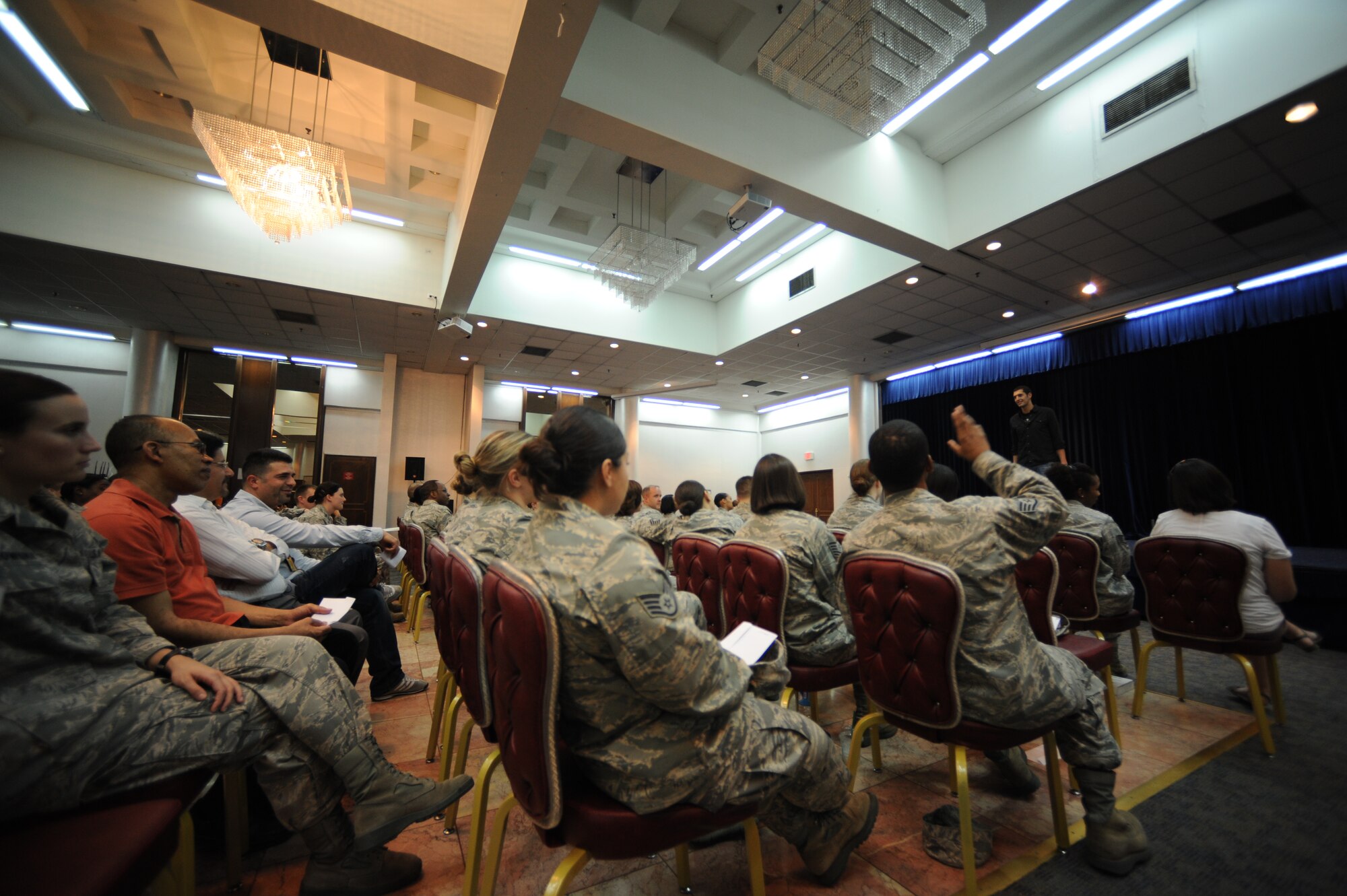 Audience members watch “Sex Signals,'' a two-person improvisational comedy show April 4, 2012, at Incirlik Air Base, Turkey. The show allowed audience participation to depict scenarios involving early warning signs of relationship violence and prevent sexual assault. (U.S. Air Force photo by Senior Airman Jarvie Z. Wallace/Released)