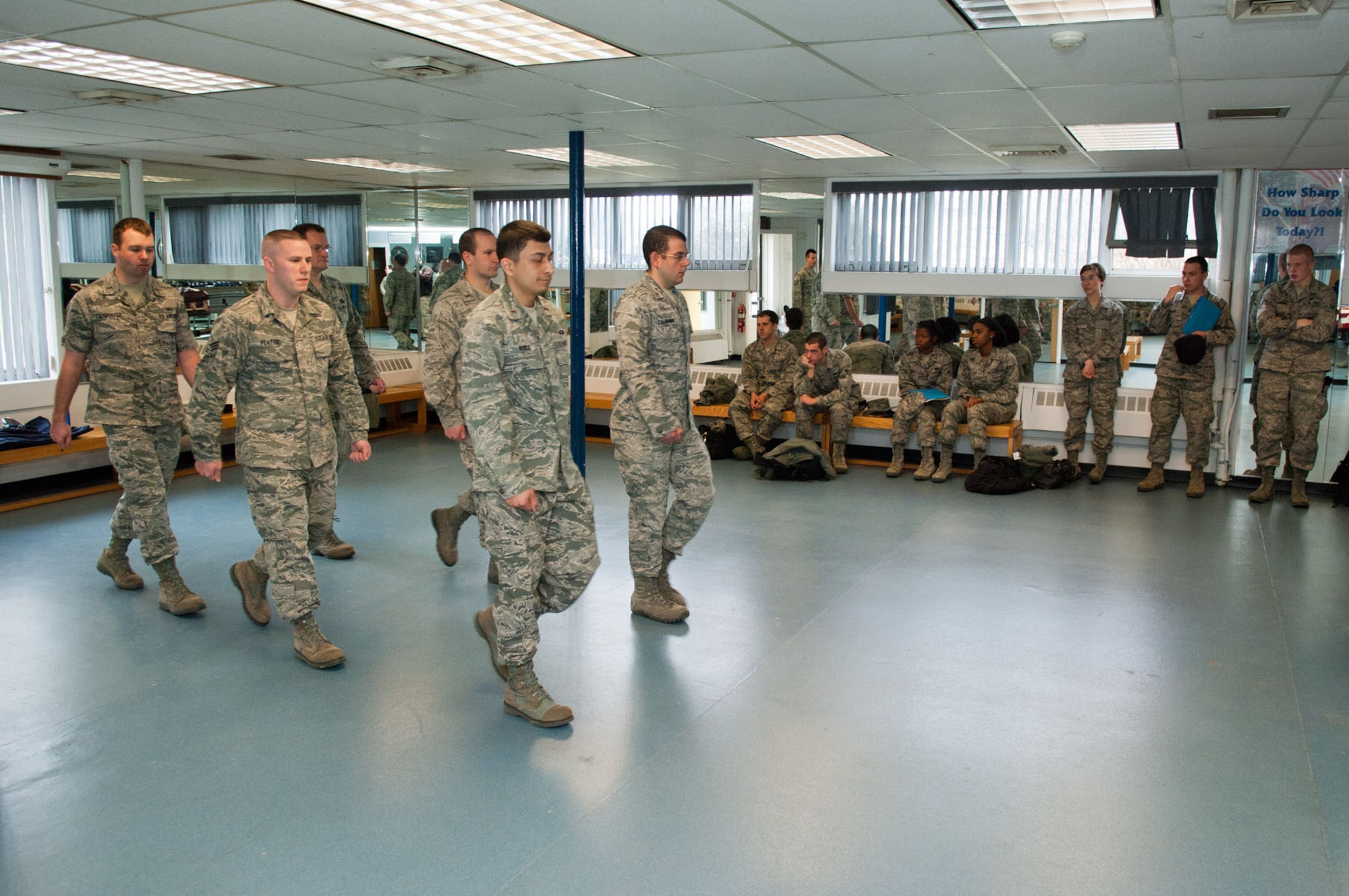 HANSCOM AIR FORCE BASE, Mass. – First Term Airmen’s Course attendees watch as members of the Patriot Honor Guard give them a demonstration March 29. FTAC is designed to help transition the Air Force's first term airmen from a training environment to the operational Air Force and highlights responsibilities as well as opportunities for new airmen. (U.S. Air Force photo by Rick Berry)