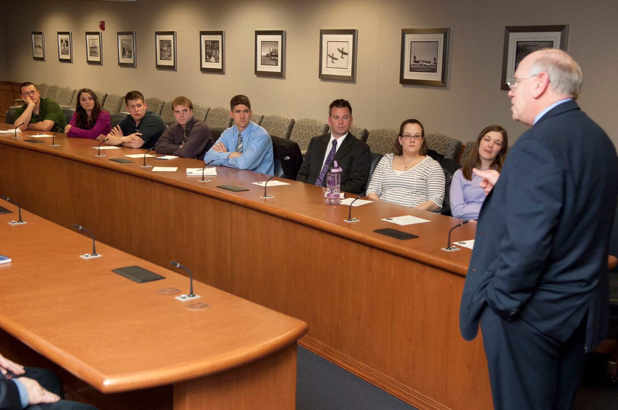 HANSCOM AIR FORCE BASE, Mass. -- Members of the Hanscom Junior Force Council listen to Rich Lombardi, Electronic Systems Center executive director, during a "fireside" mentoring discussion in Building 1606 March 29. Lombardi spoke with the group, as part of the senior leader speaker series, and then fielded questions on a variety of topics.  (U.S. Air Force photo by Mark Wyatt)