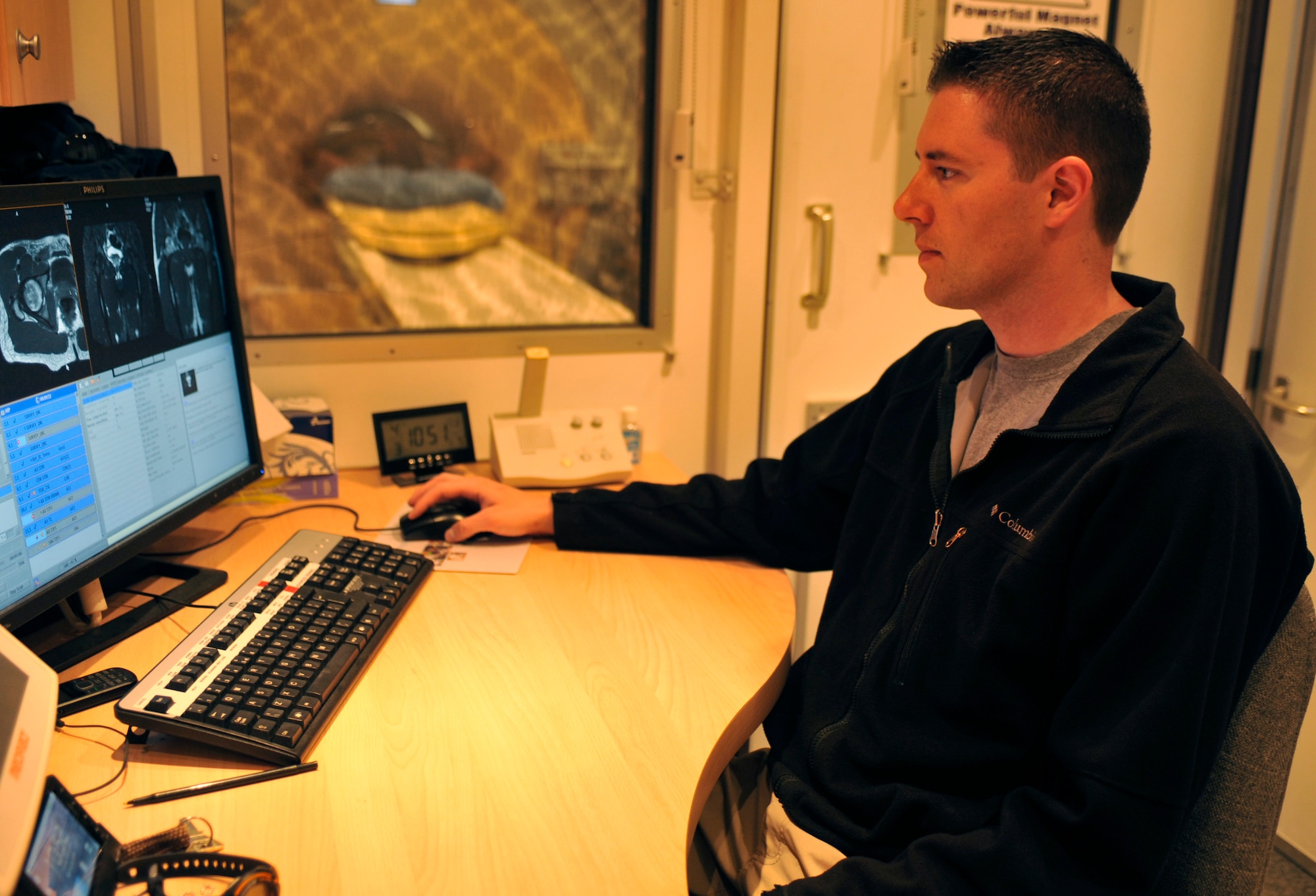 Cody Turner examines a patient’s magnetic resonance imaging scans at Bagram Airfield, Afghanistan, April 3, 2012. Turner is an MRI technician with the 455th Medical Support Squadron and hails from Avon, Conn. (U.S. Air Force photo/Airman 1st Class Ericka Engblom)