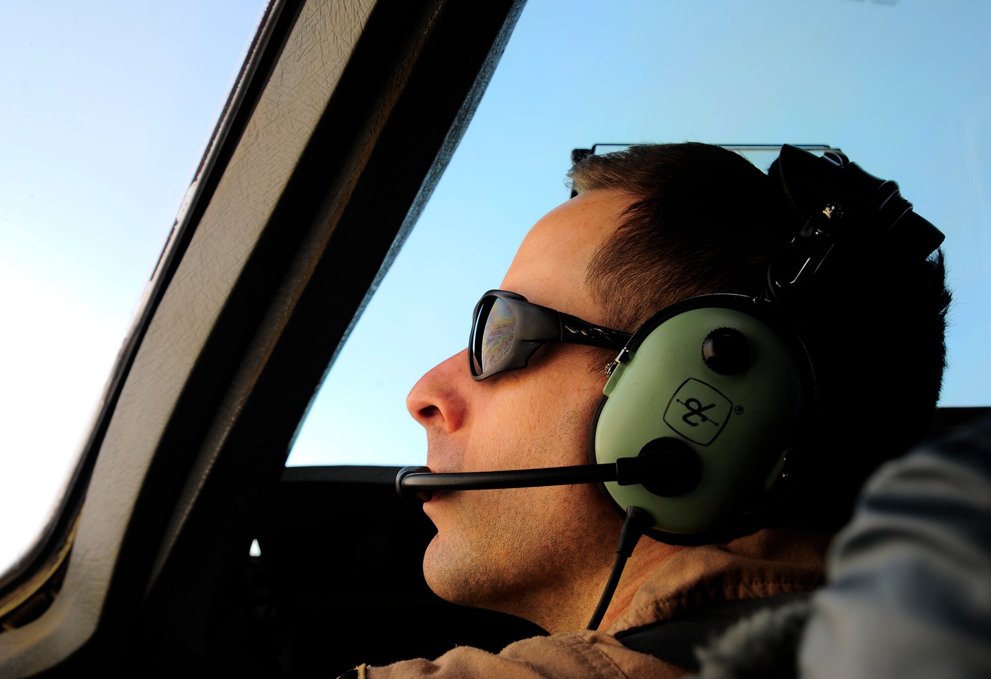 Capt. Bill Scharfenberg commands a C-17 Globemaster III March 20, 2012, at 25,000 feet in the air. Scharfenberg is an 817th Expeditionary Airlift Squadron Detachment 1 C-17 Globemaster III pilot deployed to the Transit Center at Manas, Kyrgyzstan, from Joint Base Lewis-McChord, Wash. Pilots are ultimately responsible for the quarter-of-a-billion-dollar aircraft they're commanding and for coordinating flight times to deliver passengers and supplies to their destinations. (U.S. Air Force photo/Staff Sgt. Angela Ruiz)