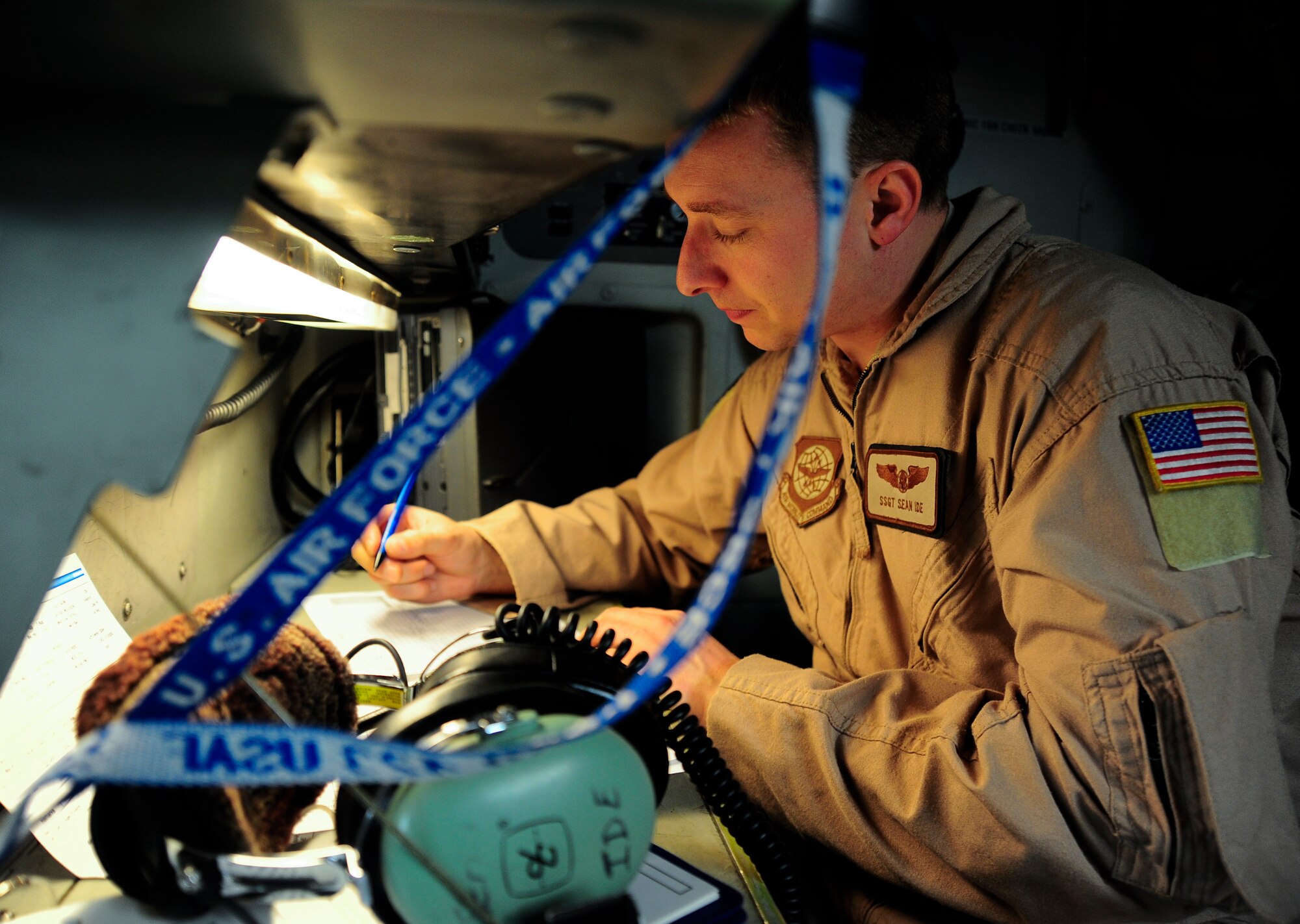Staff Sgt. Sean Ide documents information on weight and balance forms while on a C-17 Globemaster III March 20, 2012, at the Transit Center at Manas, Kyrgyzstan. The aircraft, emergency equipment, fuel, cargo and passenger weights must be balanced properly on the C-17 to ensure the aircraft isn't overloaded and can fly safely. Ide is an 817th Expeditionary Airlift Squadron Detachment 1 C-17 loadmaster deployed here from Joint Base Lewis-McChord, Wash. (U.S. Air Force photo/Staff Sgt. Angela Ruiz)