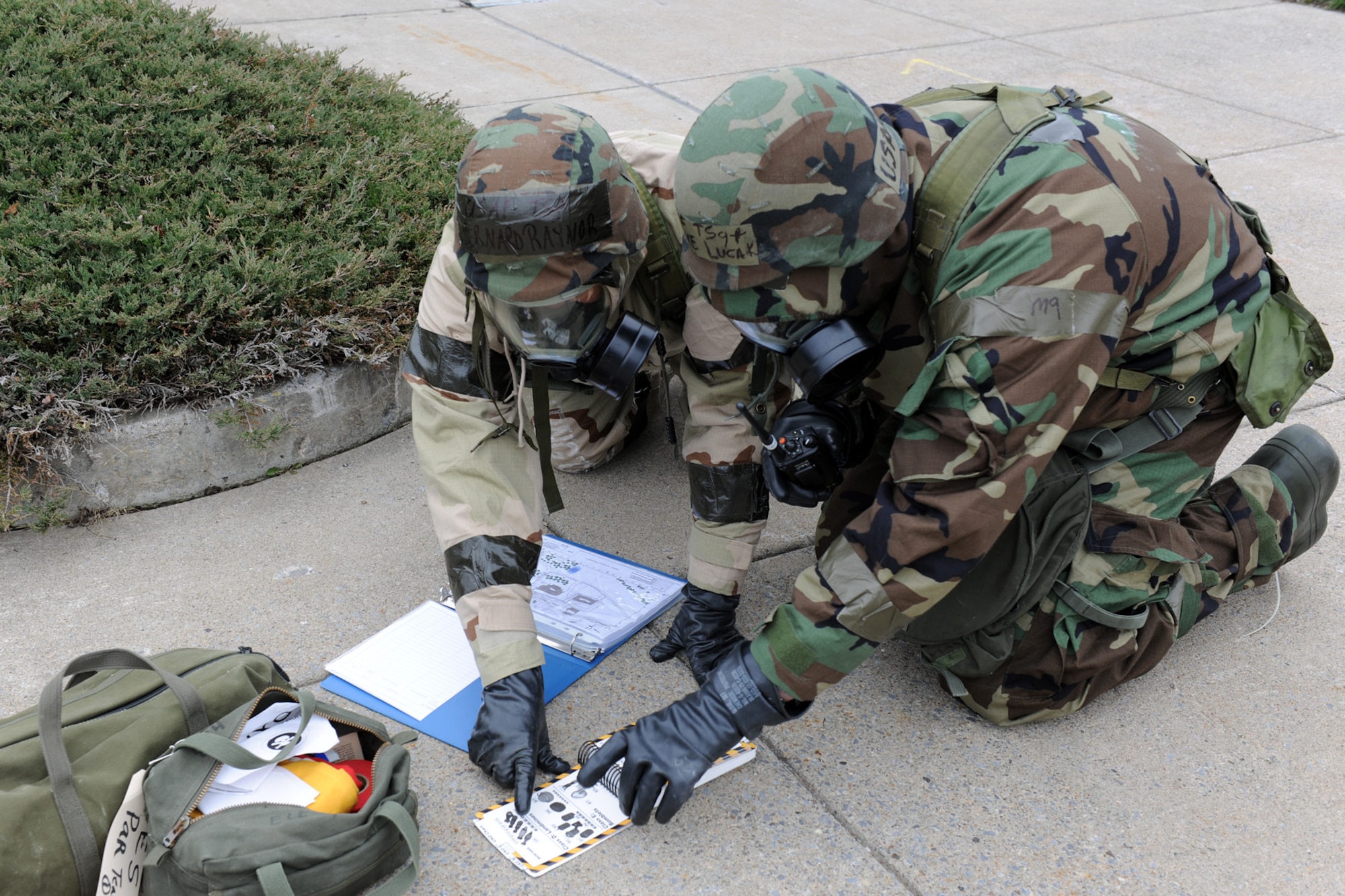 Members of the New York Air National Guard’s 174th Fighter Wing simulate how to respond to an attack at an overseas location during an Operational Readiness Exercise conducted at Hancock Field in Syracuse NY on March 31, 2012.  The exercise involved different stages of simulated attacks where members would have to don gas masks and other protective gear. Following simulated attacks members visually inspected their areas of responsibility for threats and alerted emergency response personnel.  (New York Air National Guard Photo by Tech. Sgt. Jeremy M. Call/Released)