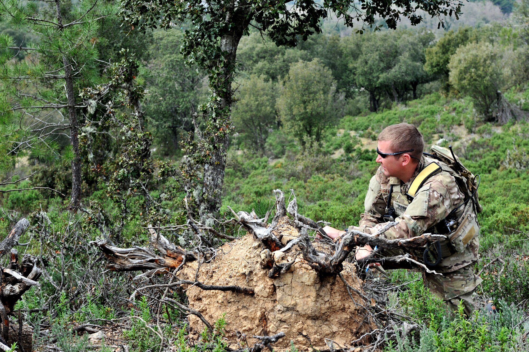 Air Force Master Sgt. Michael Huffman, 2nd Air Support Operations Squadron, simulates calling in an air attack during the Serpentex Exercise on Corsica, France, April 2, 2012. The regional air exercise consisted of multi-national forces performing close air support missions to prepare crews for Afghan operations. (U.S. Air Force photo/Airman 1st Class Caitlin O'Neil-McKeown)