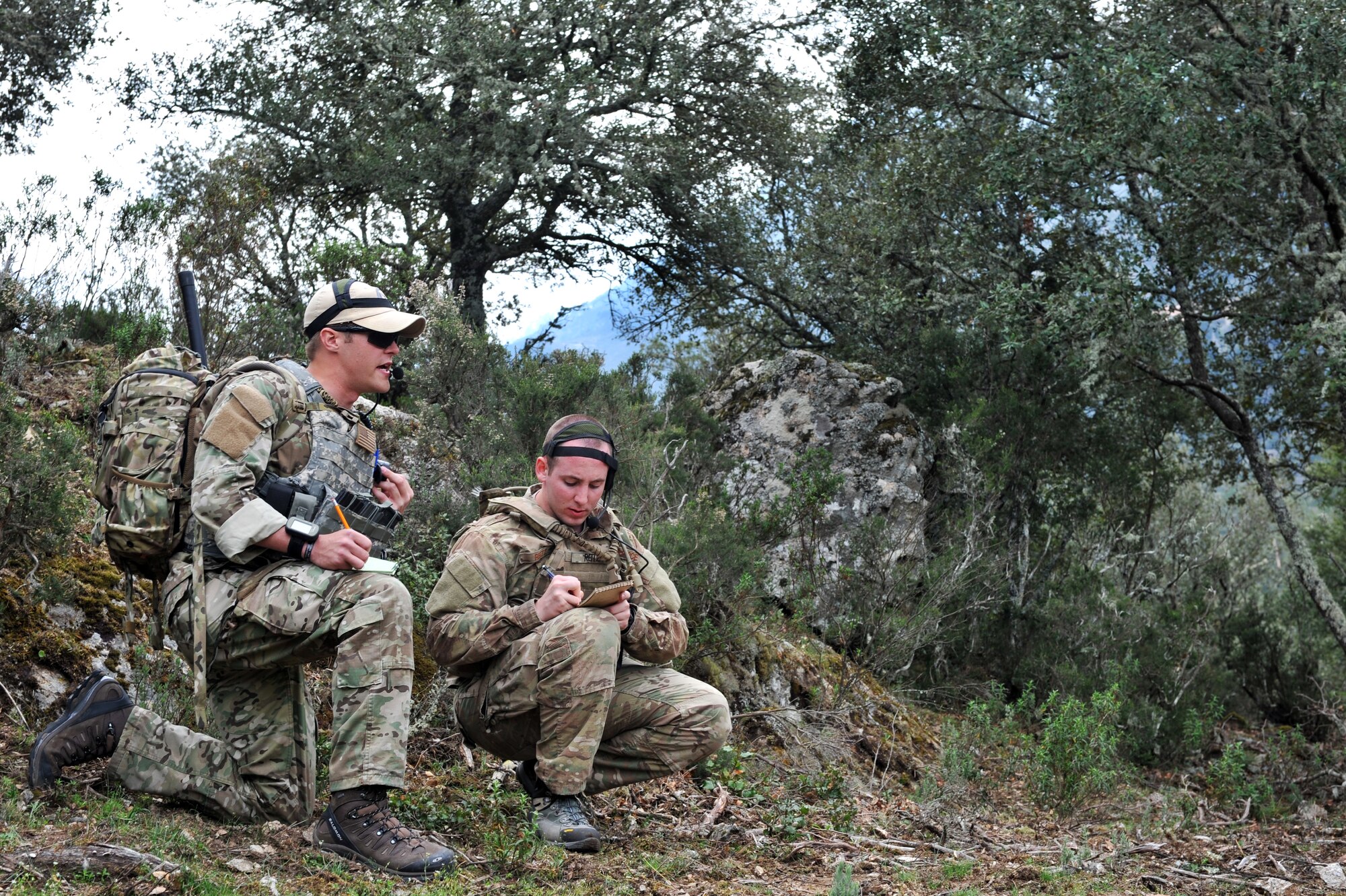 Air Force 2nd Lt. Houston Nelson and Senior Airman Eric Reitz, 2nd Air Support Operations Squadron, simulate calling in an air attack during the Serpentex Exercise on Corsica, France, April 3, 2012. The regional air exercise consisted of multi-national forces performing close air support misssions to prepare crews for Afghan operation (U.S. Air Force photo/Airman 1st Class Caitlin O'Neil-McKeown)