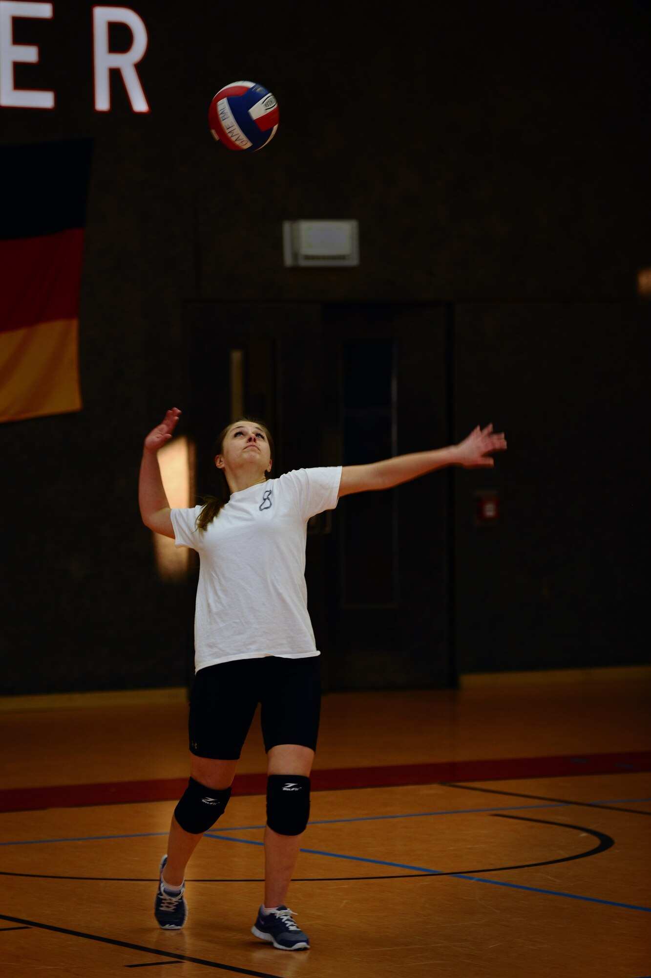 SPANGDAHLEM AIR BASE, Germany – Caley Jet, 606th Air Control Squadron, serves during the intramural volleyball championship game at the Skelton Memorial Fitness Center here April 3. ACS defeated the 702nd Munitions Support Squadron 21-25, 25-19 and 15-8 in the final game of the double-elimination tournament. The tournament included nine teams comprised of Airmen and family members from different squadrons throughout Spangdahlem AB. (U.S. Air Force photo by Airman 1st Class Dillon Davis/Released)