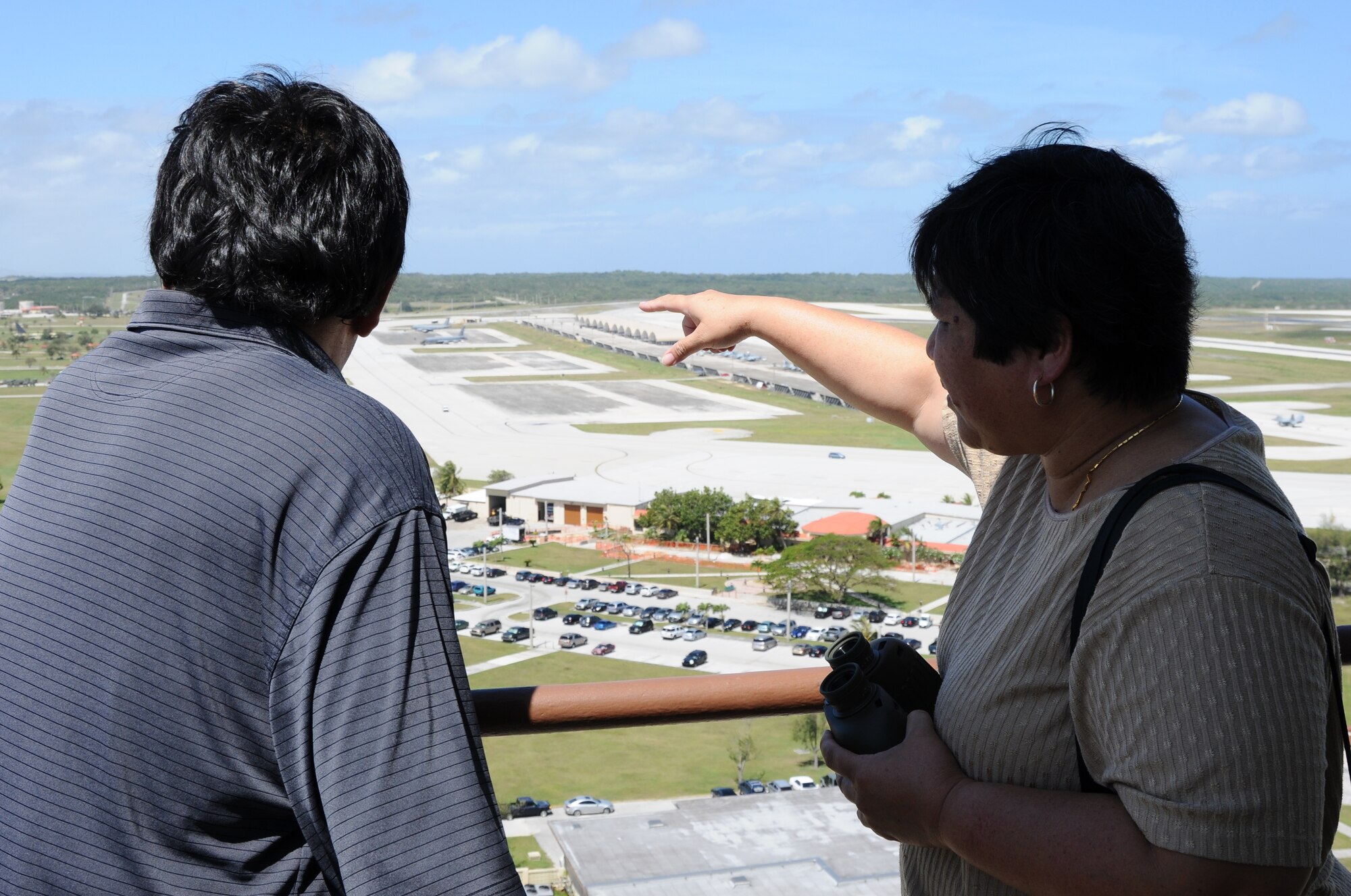 ANDERSEN AIR FORCE BASE, Guam- Honorable Ronald "Ron" J. Flores (Left) Vice
Mayor of Yigo, Guam, and Honorable Melissa B. Savares, Mayor of Dededo,
Guam, overlook the base from the air traffic control tower during a visit
April 3. The mayor from Dededo and vice mayors from Dededo and Yigo visited
Team Andersen to discuss flight operations with senior officials and to
discuss more ways the base and community could continue to work together.
(U.S. Air Force photo/Senior Airman Carlin Leslie)
