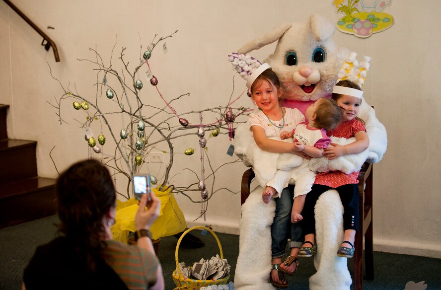 Marlo Greer takes a photo of her children with the Easter bunny at the Easter Bunny Kids at Play event April 4, 2012, at Incirlik Air Base, Turkey. The event was hosted by the 39th Force Support Squadron and included various arts and crafts, games, and an egg hunt. (U.S. Air Force photo by Senior Airman Clayton Lenhardt/Released)