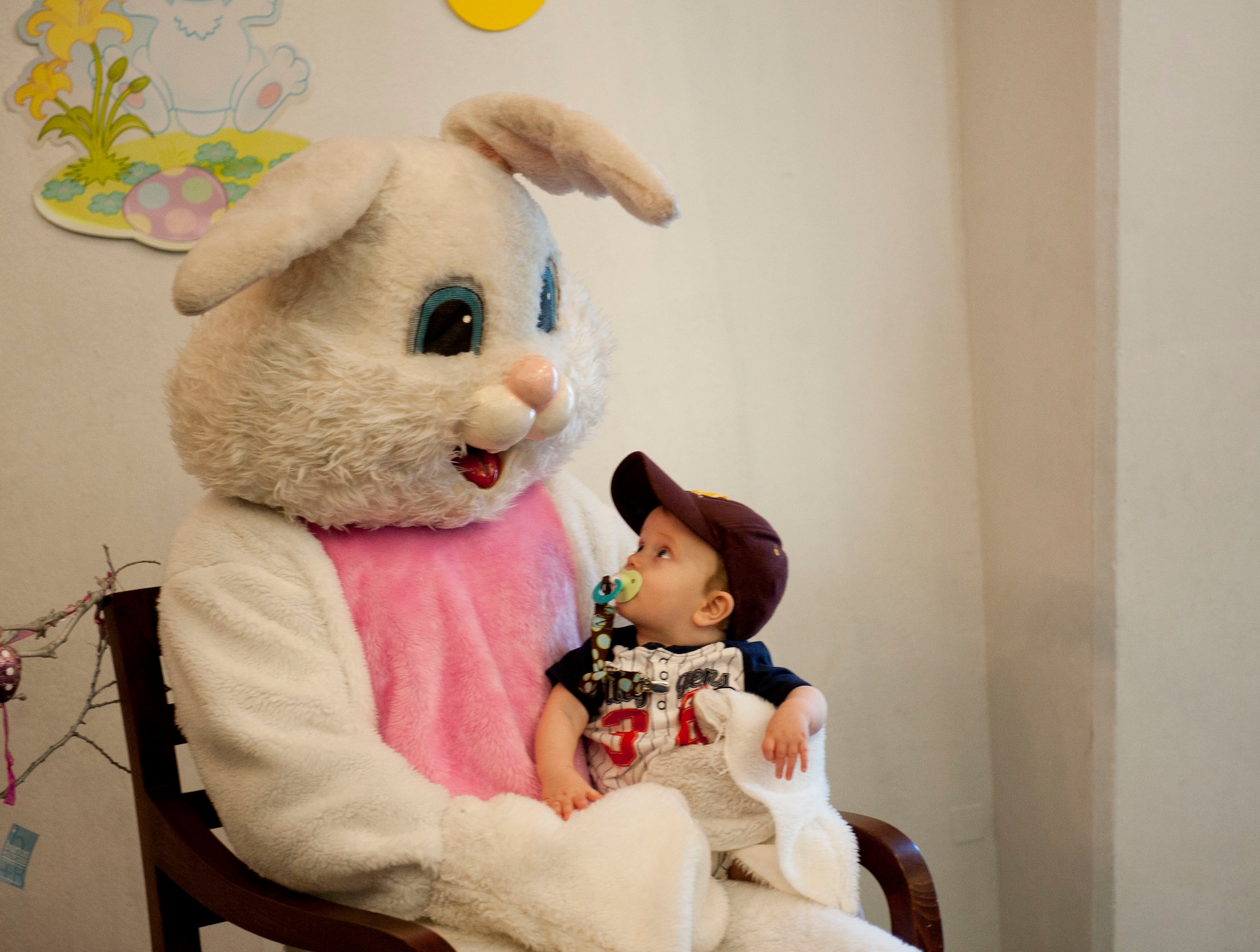 A child poses for a photo with the Easter bunny at the Easter Bunny Kids at Play event April 4, 2012, at Incirlik Air Base, Turkey. The event was hosted by the 39th Force Support Squadron and included various arts and crafts, games, and an egg hunt. (U.S. Air Force photo by Senior Airman Clayton Lenhardt/Released)