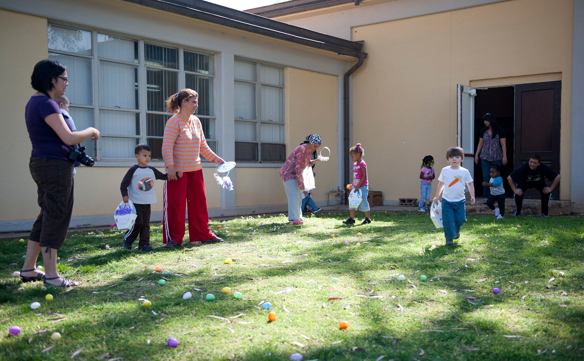 Children hunt for eggs at the Easter Bunny Kids at Play event April 4, 2012, at Incirlik Air Base, Turkey. The event was hosted by the 39th Force Support Squadron and included arts and crafts, games, and a chance to take photos with the Easter bunny. (U.S. Air Force photo by Senior Airman Clayton Lenhardt/Released)
