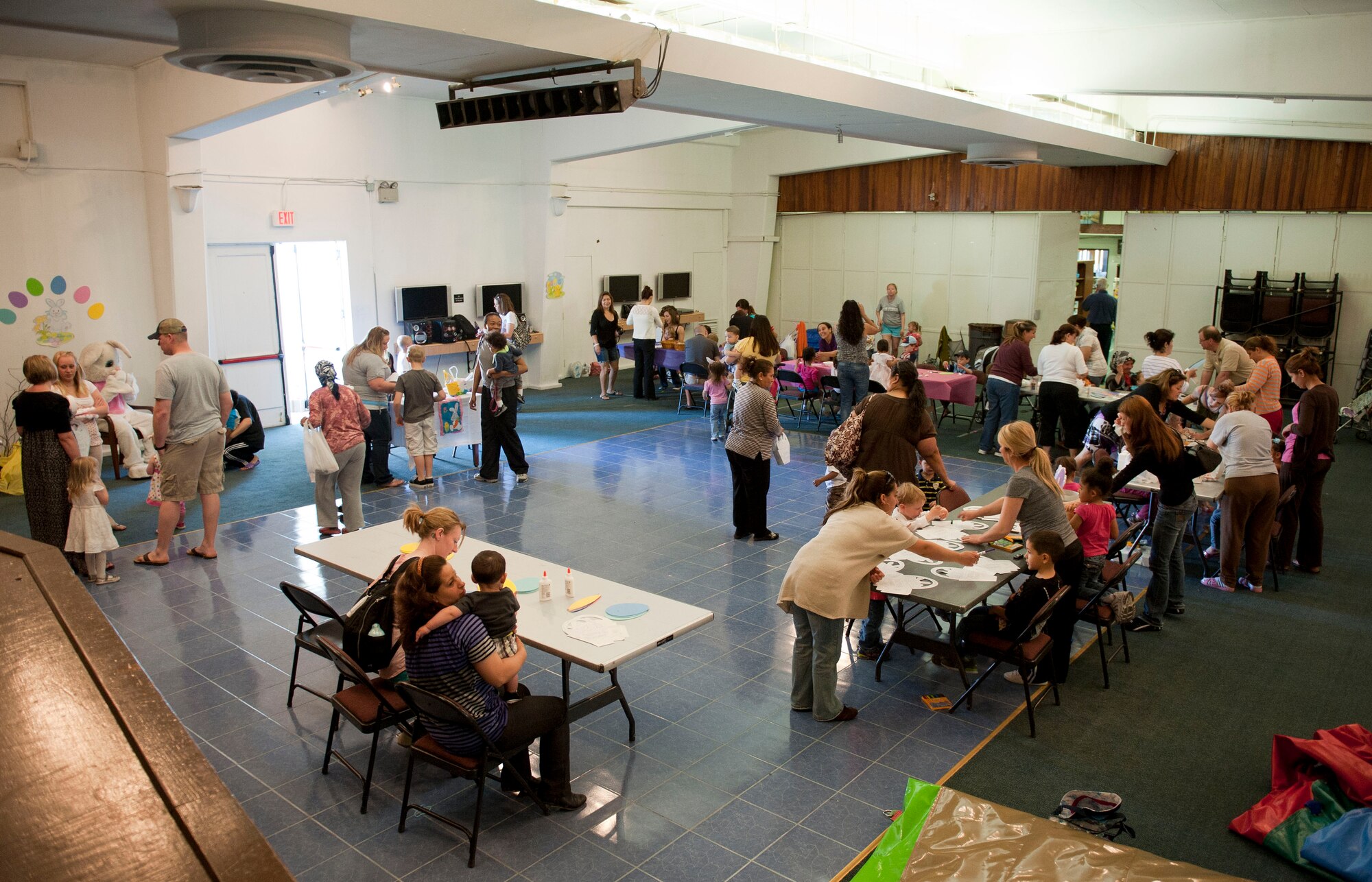 Children and parents make various arts and crafts at the Easter bunny Kids at Play event April 4, 2012, at Incirlik Air Base, Turkey. The event was hosted by the 39th Force Support Squadron and included games, a chance to take photos with the Easter Bunny, and an egg hunt. (U.S. Air Force photo by Senior Airman Clayton Lenhardt/Released)