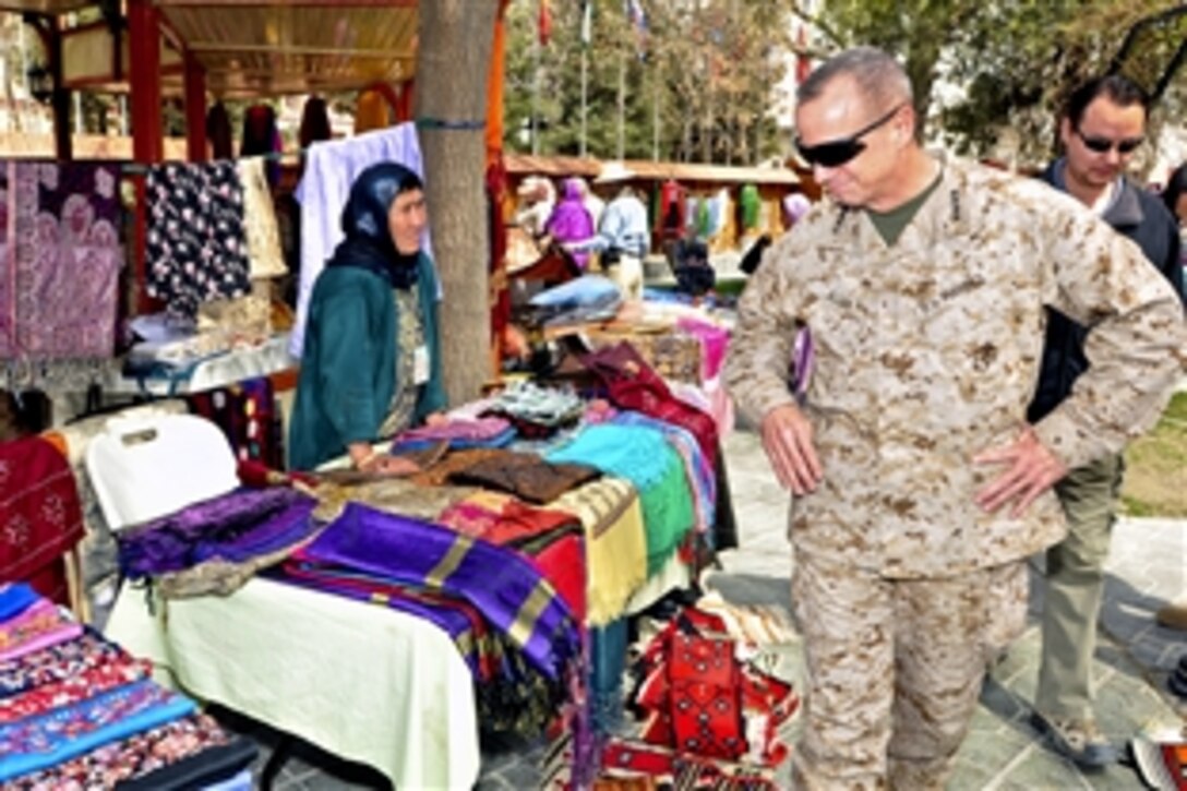 U.S. Marine Corps Gen. John R. Allen, commander of U.S. and international forces in Afghanistan, takes time to see handmade goods during a women’s bazaar in Destille Gardens at the International Security Assistance Force headquarters in Kabul, Afghanistan, March 31, 2012.