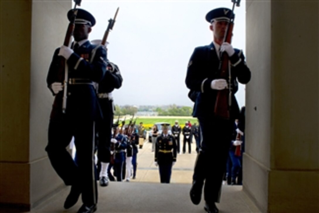 Soldiers, sailors, Marines, airmen and Coast Guardsmen position themselves to conduct an honor cordon for Secretary of Defense Leon E. Panetta to welcome Singaporean Defense Minister Ng Eng Hen to the Pentagon on April 4, 2012.  