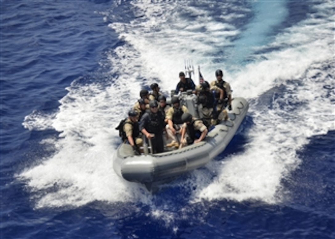 Members of a visit, board, search and seizure team return their rigid-hull inflatable boat to the guided missile destroyer USS Paul Hamilton (DDG 60) during exercise Koa Kai 12-2 in the Pacific Ocean on April 1, 2012.  Koa Kai is a weeklong joint exercise between the U.S. Navy and the Japan Maritime Self-Defense Force that aims to prepare and test ship readiness to deploy and respond quickly to support maritime strategy.  