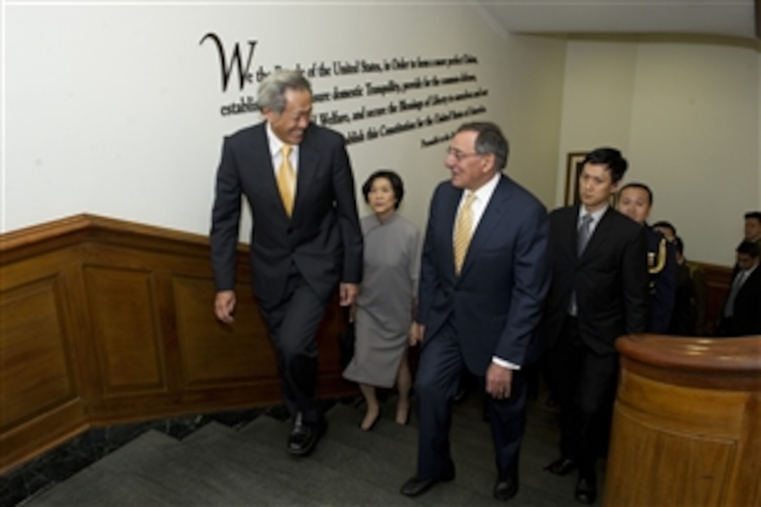 Secretary of Defense Leon E. Panetta escorts Defense Minister of Singapore Ng Eng Hen to a meeting in the Pentagon on April 4, 2012.  
