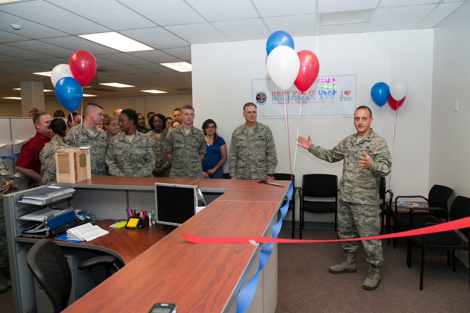 Maj. Christopher Busque, 49th Force Support Squadron commander, gives opening remarks at the 49th FSS Military Personnel Section grand opening April 6. Members of Team Holloman came together to commemorate the grand opening ceremony of the newly renovated 49th MPS. The $244,000 renovation, which was funded directly by the U.S. Air Force, began in February. (U.S. Air Force photo by Senior Airman DeAndre Curtiss / Released) 
