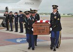 The remains of Army 1st Lt. Clovis T. Ray are ceremoniously carried to an awaiting hearse by an Army detail at the Kelly Field flightline March 30 as senior leaders from the various military services in San Antonio area pay their respects. Ray was killed in action March 15 while deployed to Kunar Province, Afghanistan. (U.S. Air Force photo/Alan Boedeker)