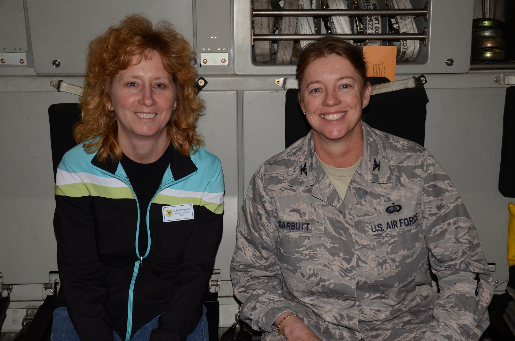 Honorary Commander Dr. Martha Hofstetter, Assistant to the Campus Director at Delaware Technical Community College’s Terry Campus, enjoyed the orientation flight April 4, 2012 aboard a C-17 Globemaster II alongside her military counterpart Col. Joan Garbutt, 436th Mission Support Group commander.  The honorary commanders of the 436th and 512th Airlift Wings came out to Dover Air Force Base, Del., for a day-long tour including a mission brief by wing commanders, a walk-through of the 436th Operations Support Squadron where they received hands-on experience with vital emergency gear, an orientation flight, a static tour of a C-5M Super Galaxy and a visit to the airlift control tower. (U.S. Air Force photo by Staff Sgt. Dani Shea)