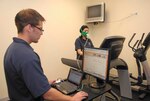 Medina Fitness Center fitness specialists Ronnie Rainey and Magda Salazar run tests on the New Leaf Active Metabolic Training System. New Leaf should be available to customers sometime in late April or early May. (U.S. Air Force photo/Alan Boedeker)