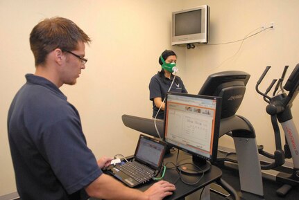 Medina Fitness Center fitness specialists Ronnie Rainey and Magda Salazar run tests on the New Leaf Active Metabolic Training System. New Leaf should be available to customers sometime in late April or early May. (U.S. Air Force photo/Alan Boedeker)