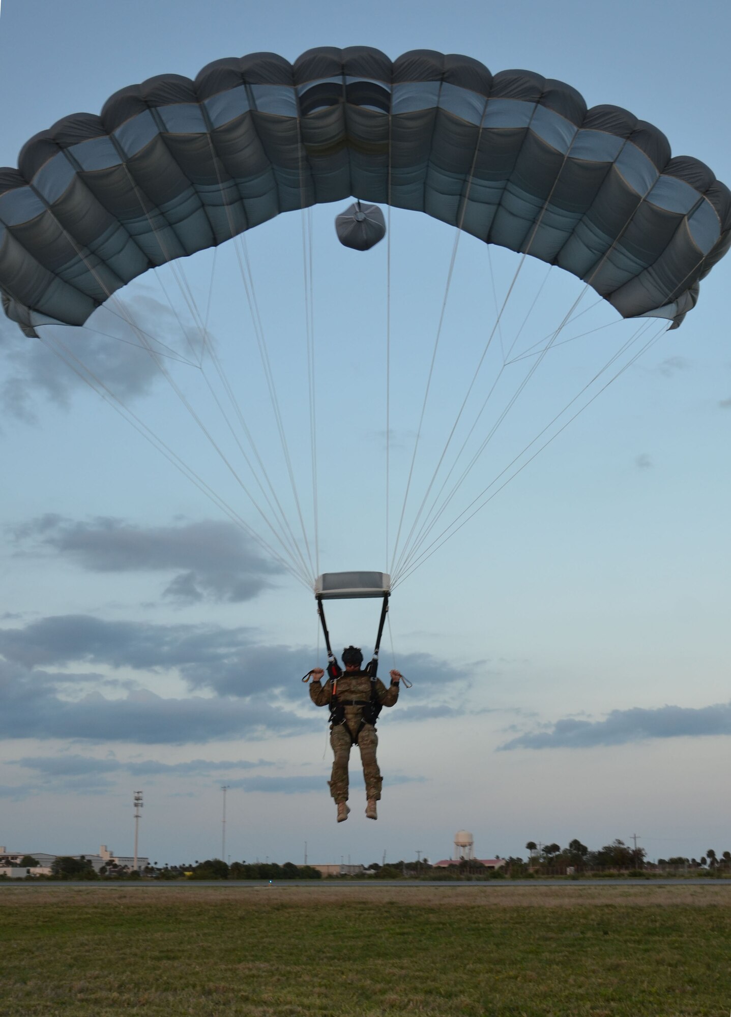 Master Sgt. Blain Morgan, Air Force Reserve pararescueman, comes in for a perfect landing after a free-fall jump here April 5. Airmen of the 920th Rescue Wing, Patrick Air Force Base, Fla., train extensively to keep current on their combat search and rescue qualifications. This includes parachuting during daylight and dusk. Pararescuemen are highly trained in parachuting, mountaineering and SCUBA and are among the most highly trained emergency trauma specialists in the U.S. military. With this medical and rescue expertise, PJs are able to perform life-saving missions in the world?s most remote areas. (U.S. Air Force photo/2nd Lt. Leslie Forshaw)