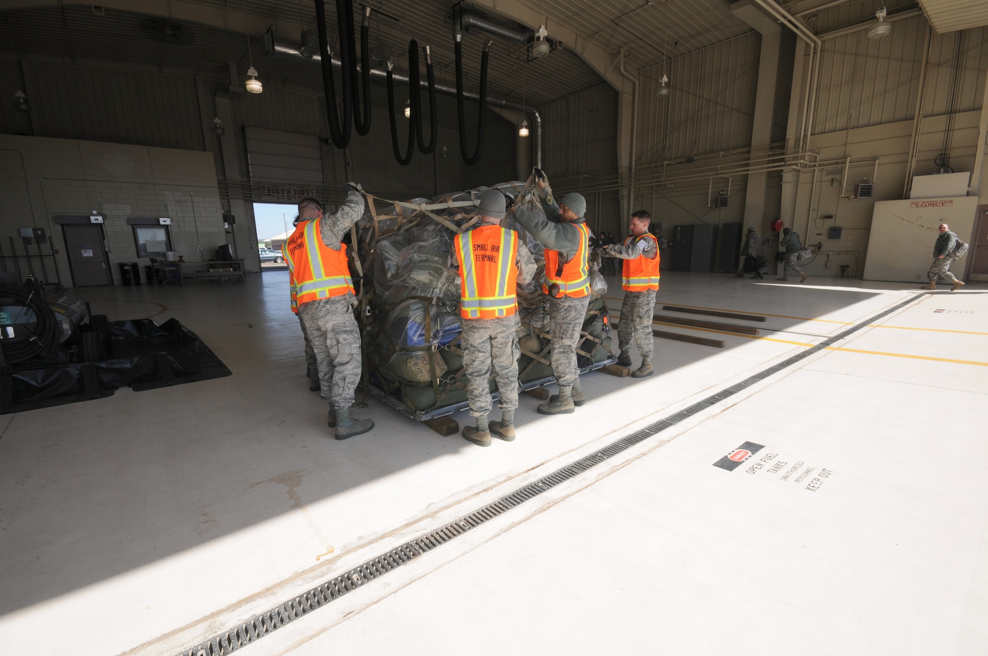 Battle Creek Air National Guard Aerial Port servicemembers facilitate the arrival of U.S. Army soldiers via C-130 from the 1071st Maintenance Company on Saturday, March 10, 2012 at the Battle Creek Air National Guard Base, Battle Creek, Mich.  (U.S. Air National Guard photo by Master Sgt. Sonia Pawloski/released)