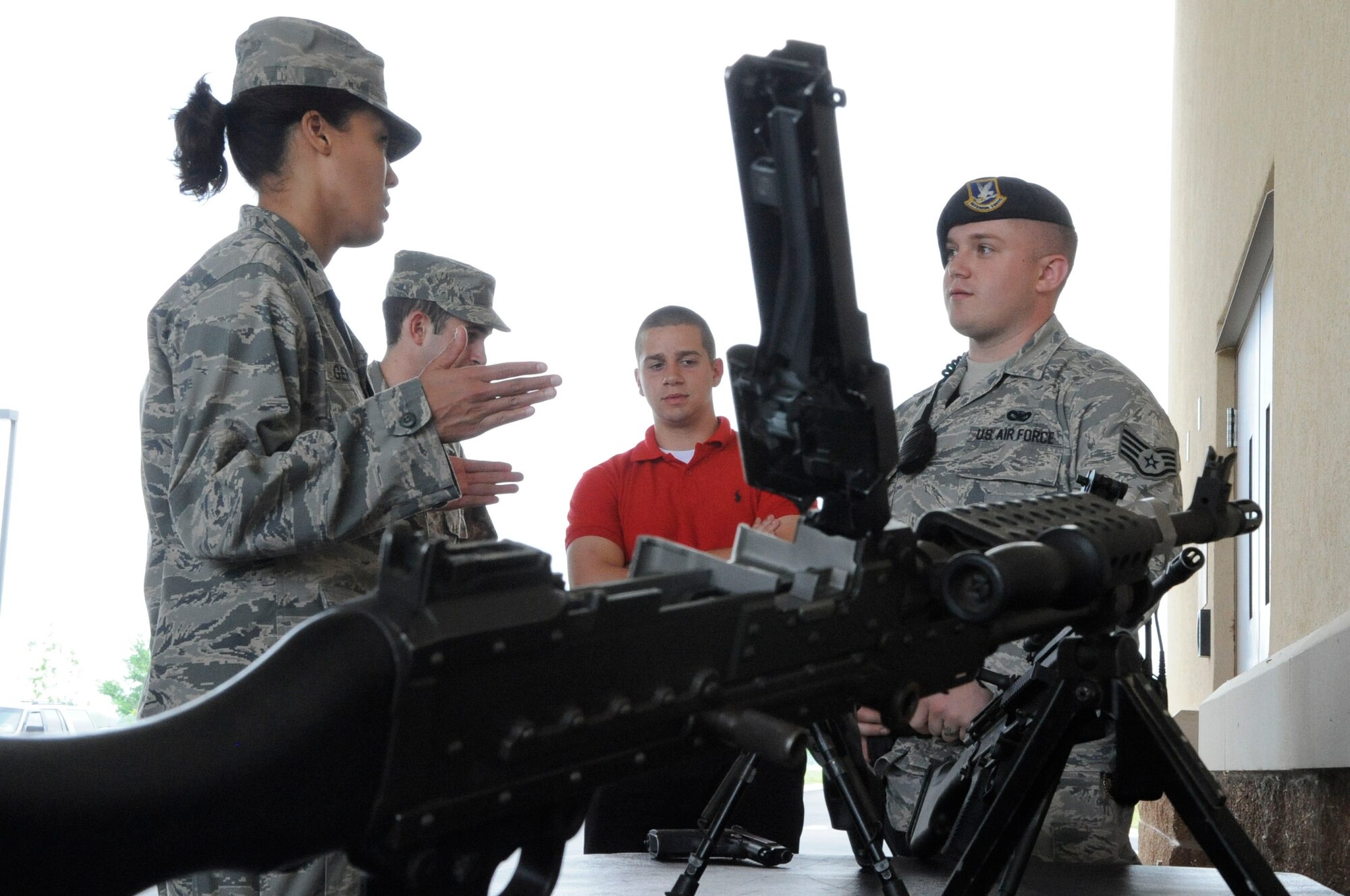 Air Force Reserve Officers' Training Corps cadets from Tulane University and Louisiana Tech University chat with Airmen from the 2nd Security Forces Squadron during their visit to Barksdale Air Force Base, La., March 30. Members of 2 SFS explained to the cadets the different weapons systems they are trained on. (U.S. Air Force photo/Airman 1st Class Andrea F. Liechti) (RELEASED)
