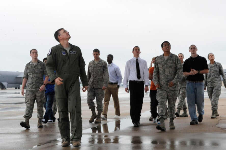 Air Force Reserve Officers' Training Corps cadets from Tulane University and Louisiana Tech University tour a B-52H Stratofortress on the flightline during their visit to Barksdale Air Force Base, La., March 30. Capt. David McClintic, 20th Bomb Squadron electronic warfare officer, led the cadets around the aircraft showing them the areas he inspects prior to every flight. (U.S. Air Force photo/Airman 1st Class Andrea F. Liechti) (RELEASED)
