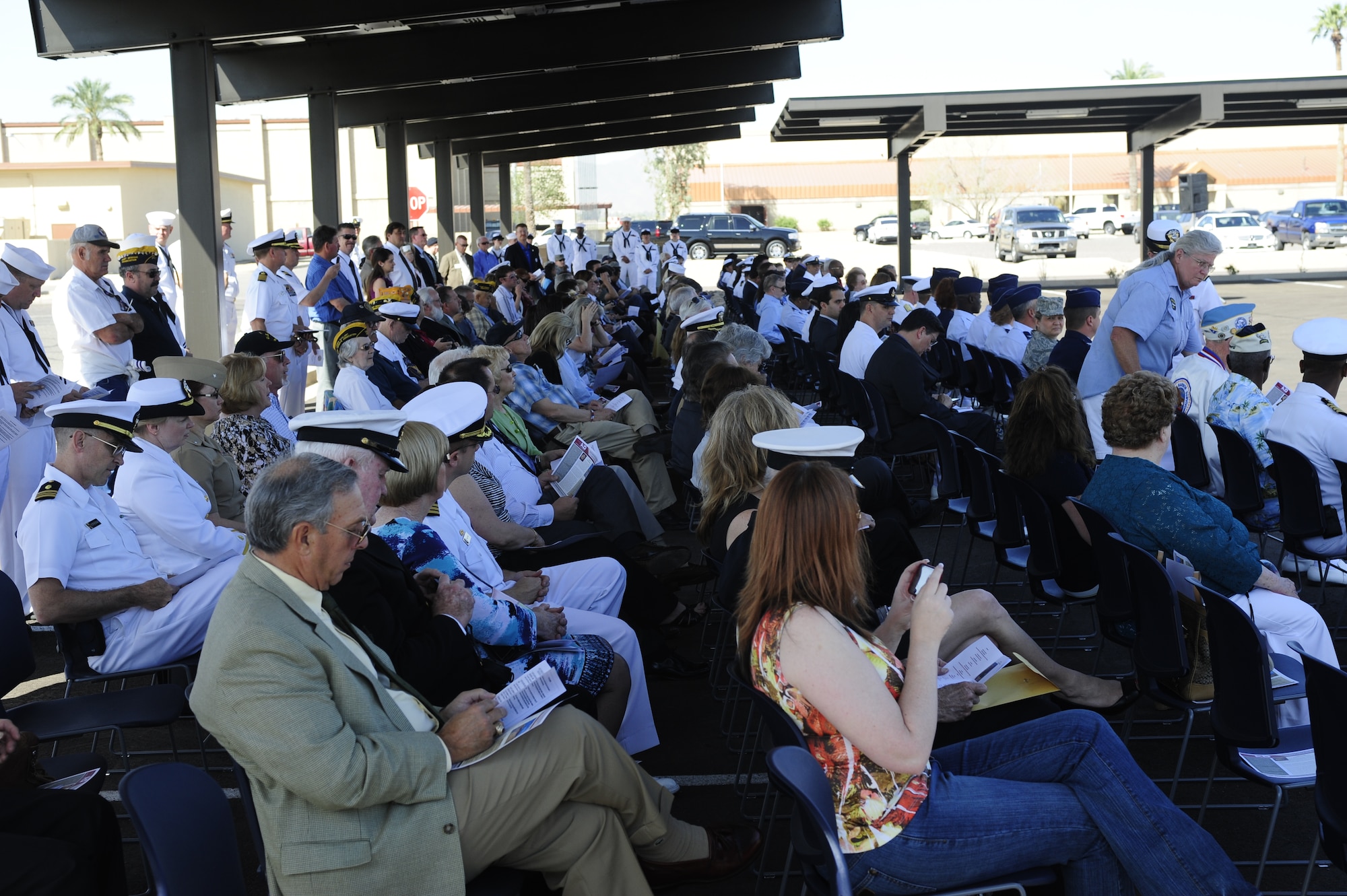 Attendees listen to speakers at the Navy Operational Support Center Phoenix ribbon cutting ceremony March 30 at Luke Air Force Base.  The NOSC will support Navy Reserve components in the Phoenix area.  (U.S. Air Force photo by Staff Sgt. Jason Colbert)