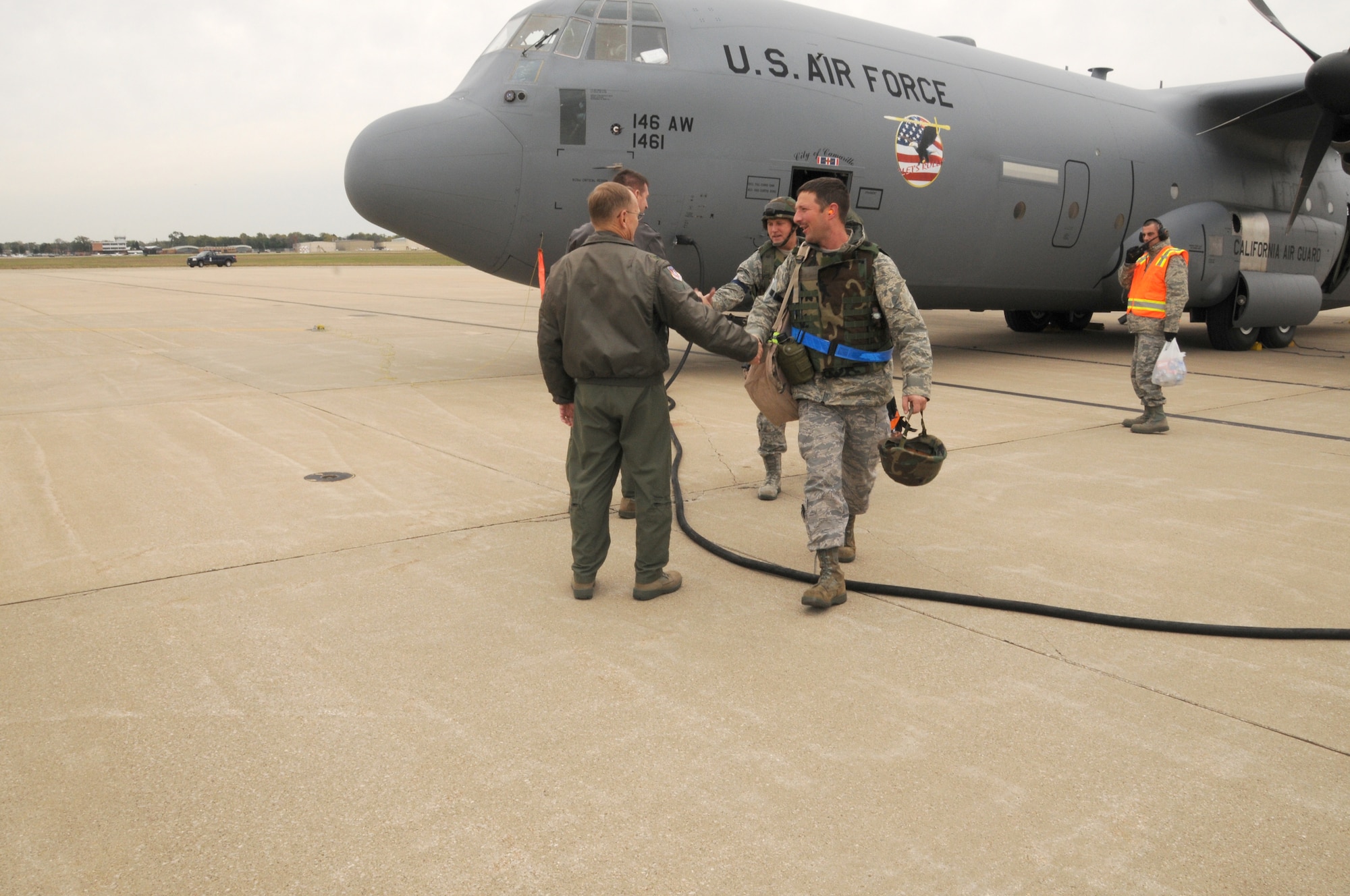 Servicemembers of the 110th Airlift Wing, Battle Creek, Mich., arrive home from Volk Field, Wis. after completing the Wing’s first Air Mobility Command Operational Readiness Inspection on Tuesday, Oct. 18, 2011. (U.S. Air Force photo by Master Sgt. Sonia Pawloski/released)