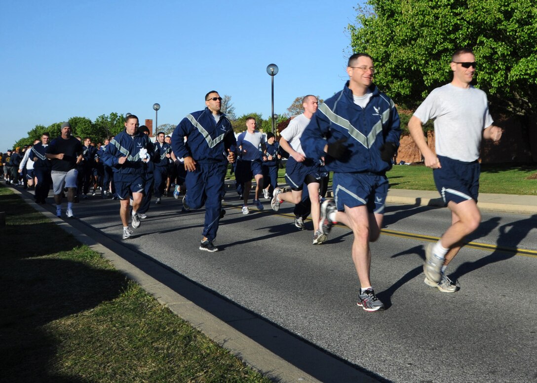Team Andrews military members, spouses and dependents take off from the west fitness center to begin a Sexual Assault Awareness 5k walk/run hosted by Col. Ken Rizer, 11th Wing/Joint Base Andrews commander, April 6. The goal of Sexual Assault Awareness Month (SAAM) is to raise public awareness and to educate communities and individuals on how to prevent sexual violence. (U.S. Air Force photo/Senior Airman Laura Turner)
