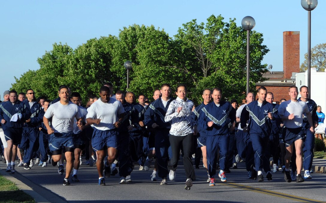 Team Andrews military members, spouses and dependents take off from the west fitness center to begin a Sexual Assault Awareness 5k walk/run hosted by Col. Ken Rizer, 11th Wing/Joint Base Andrews commander, April 6. The goal of Sexual Assault Awareness Month (SAAM) is to raise public awareness and to educate communities and individuals on how to prevent sexual violence. (U.S. Air Force photo/Senior Airman Laura Turner)