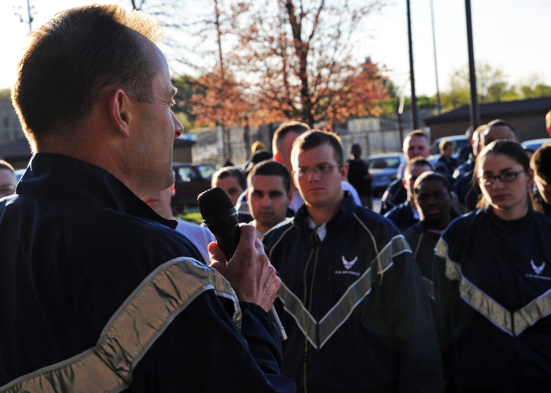 Col. Ken Rizer, 11th Wing/Joint Base Andrews commander, addresses Team Andrews military members, spouses and dependents before leading a Sexual Assault Awareness 5k walk/run at the west fitness center April 6. The goal of Sexual Assault Awareness Month (SAAM) is to raise public awareness and to educate communities and individuals on how to prevent sexual violence. (U.S. Air Force photo/Senior Airman Laura Turner)