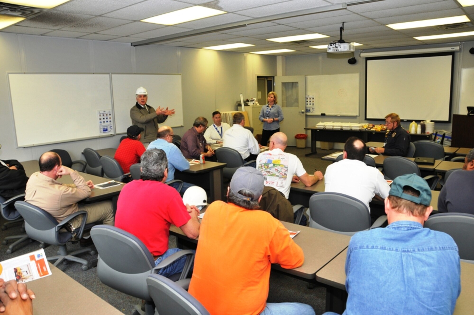 Photo caption for 120229-F-RS654-009: ATA General Manager Steve Pearson talks with members of the Occupational Safety Health Representative Committee during a recent meeting. (Photo by Rick Goodfriend)