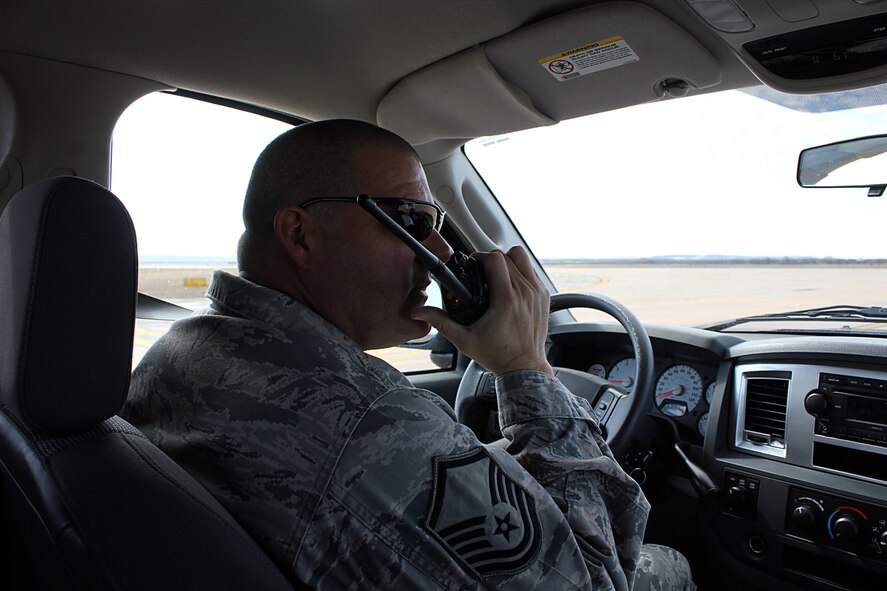 Master Sgt. Thomas Autorino, 7th Operations Support Squadron, utilizes a land mobile radio to request permission from the Dyess air traffic control tower to access on the runway during a recent air traffic system evaluation at Dyess Air Force Base, Texas. The 7th OSS Airfield Operations Flight was awarded the 2011 Air Combat Command Annual Airfield Operations Award for Airfield Management Facility of the Year for the second year in a row. (U.S. Air Force photo by Senior Airman Evan Stewart/Released)