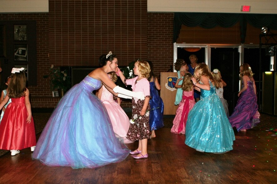 As Cinderella, Holly Jones, a co-op employee for Services, engages each of the princesses individually on the dance floor to give them her undivided attention. (Photo by Andrea Stephens)