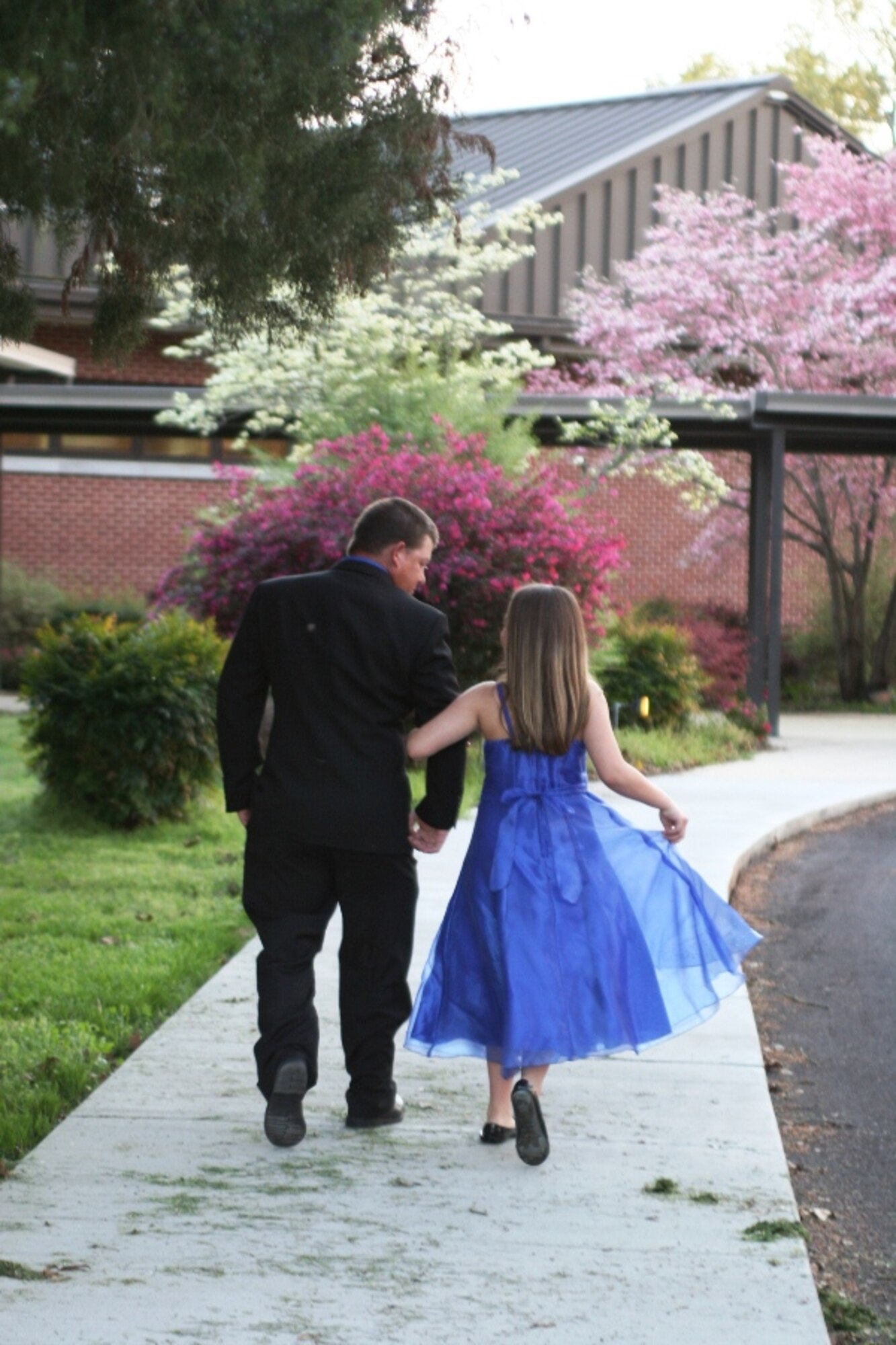 Father and daughter duo, Jamie and Kylee Stephens share a special moment while walking to the entrance of the Arnold Lakeside Center for the first annual Daddy-Daughter Dance March 23. (Photos by Andrea Stephens)