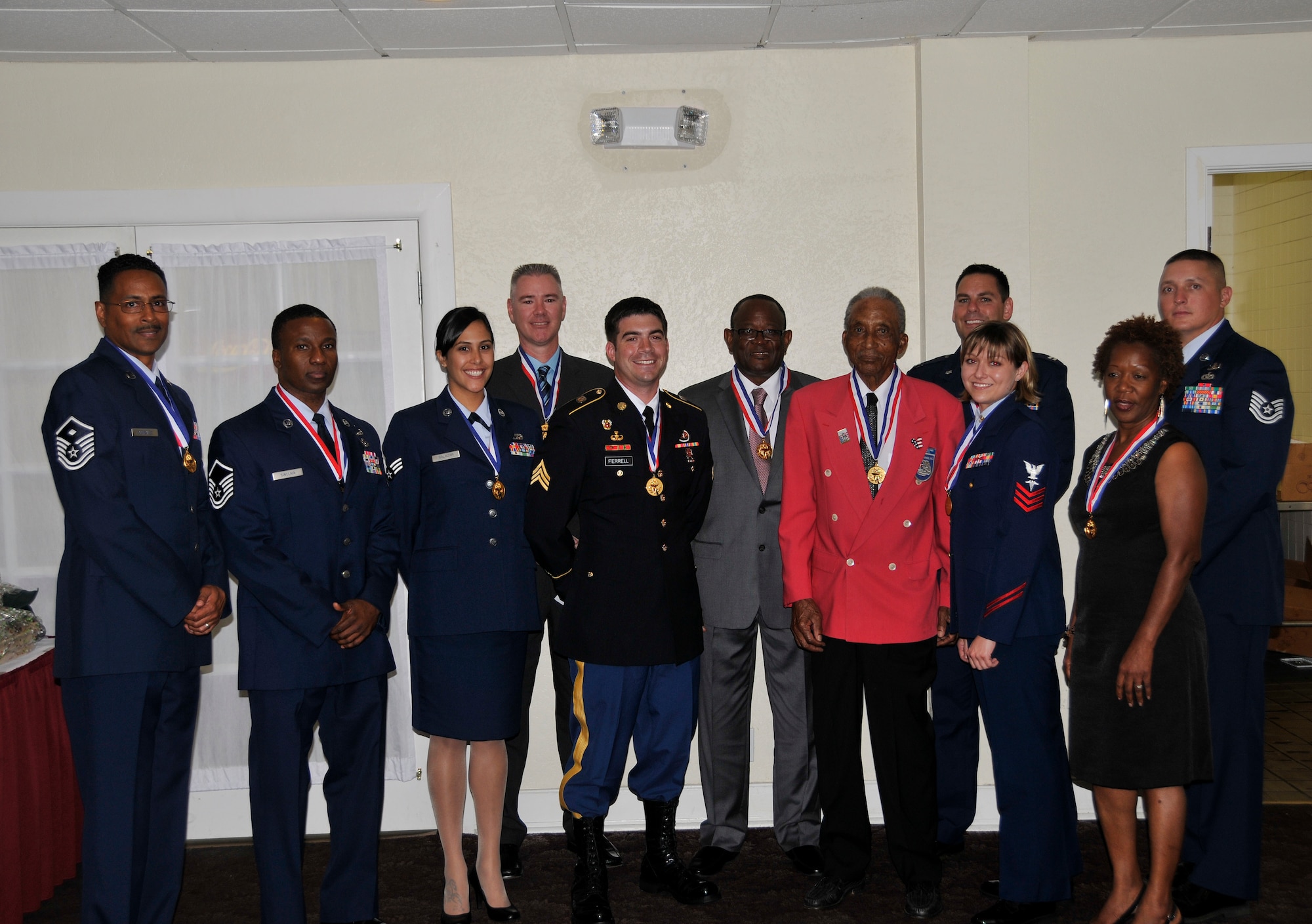 The 13th Annual Military Awards Committee winners pose for a picture at Homestead Air Reserve Base on Mar. 24. From left are: Master Sgt. Francisco Gonzalez, Master Sgt. Gavin Sinclair, Senior Airman Jacqueline Salazar, Mr. Darryl Barnes, Sgt. John Ferrell, Mr. Harriol Coats, Lt. Col. (Ret) Eldridge Williams, Capt. Toby Evans, Petty Officer 1st Class Jessica Clark, Ms. Sybil Hamilton and Tech. Sgt. Stephen Kaufman.  Not pictures is Tech. Sgt. Aaron Chase. (U.S. Air Force photo/Senior Airman Jacob Jimenez)