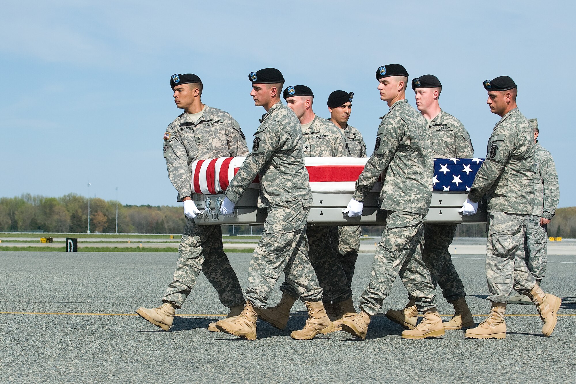 A U.S. Army carry team transfers the remains of Army Staff Sgt. Christopher L. Brown, of Columbus, Ohio, at Dover Air Force Base, Del., April 5, 2012. Brown was assigned to the 2nd Battalion, 12th Infantry Regiment, 4th Infantry Brigade Combat Team, 4th Infantry Division, Fort Carson, Colo. (U.S. Air Force photo/Steve Kotecki)
